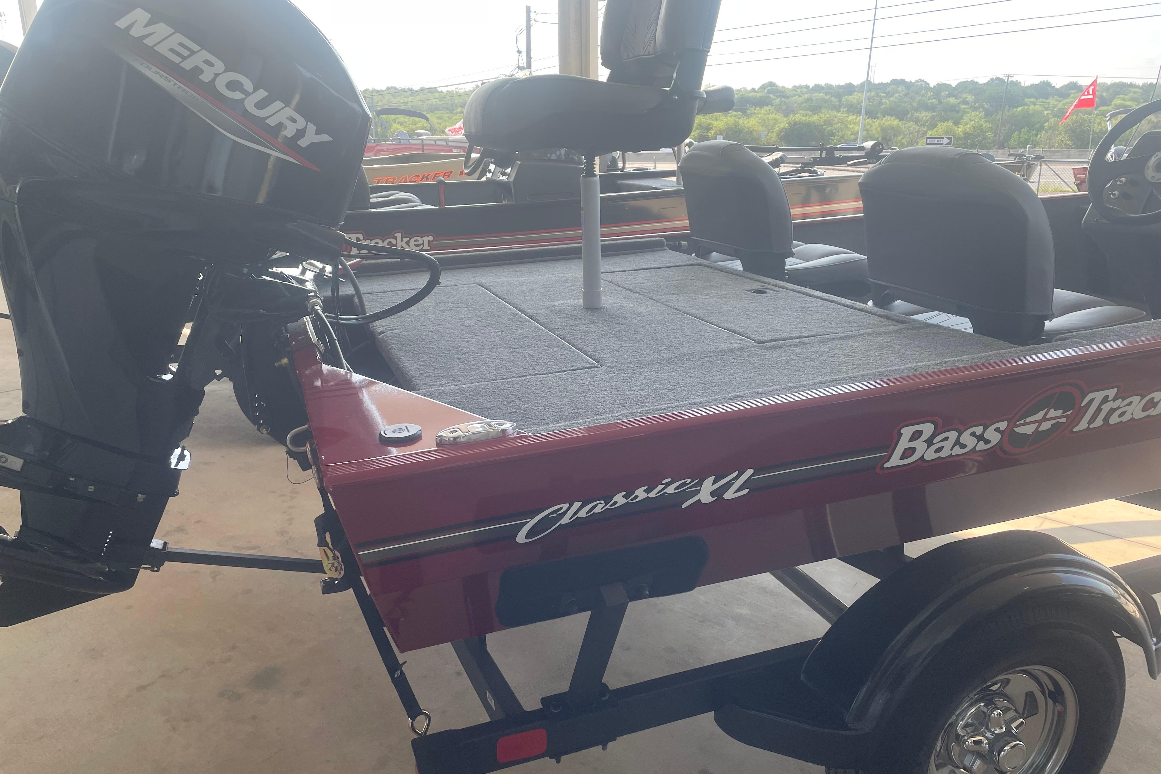 2026 Tracker Bass Tracker Classic XL boat with Mercury engine, parked on a trailer.