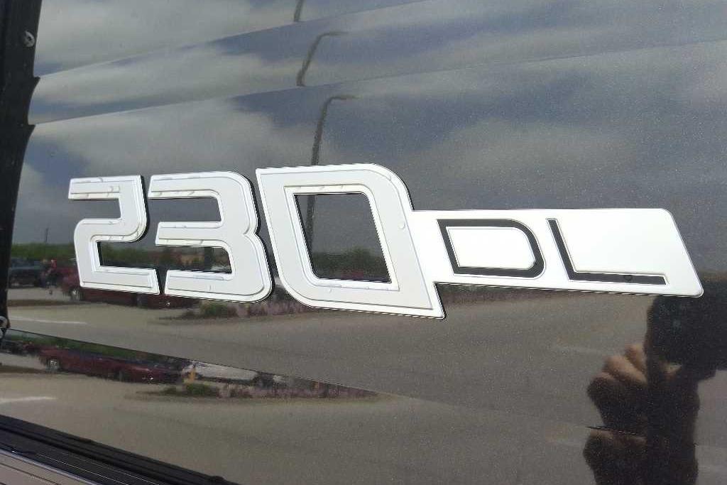 Regency 230 DL 2026 model emblem on reflective surface.