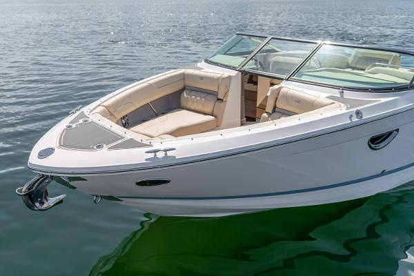 Manufacturer Provided Image: 2026 Regal LS6 boat on calm water, featuring sleek design and spacious seating.