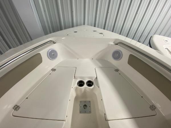 2024 Key West 203 FS boat interior with storage compartments and speakers.