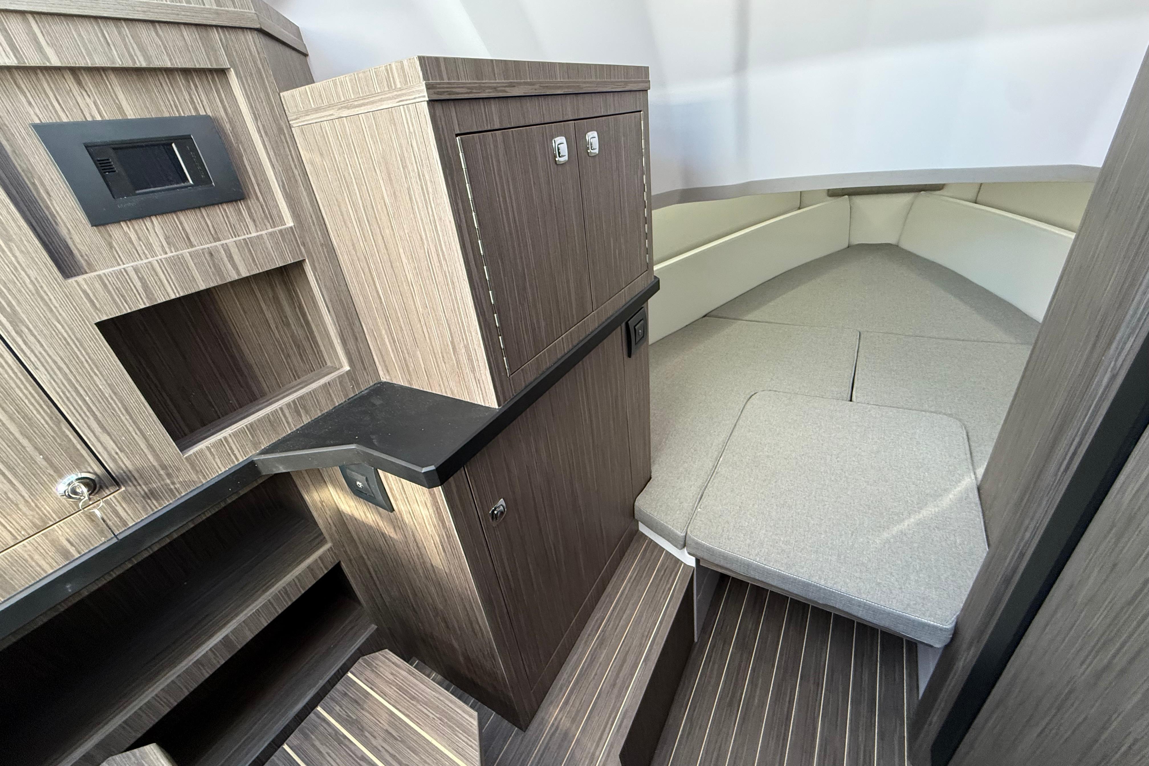 Interior of 2026 Ranieri CAYMAN 38.0 EXECUTIVE, featuring modern wood cabinetry and seating.