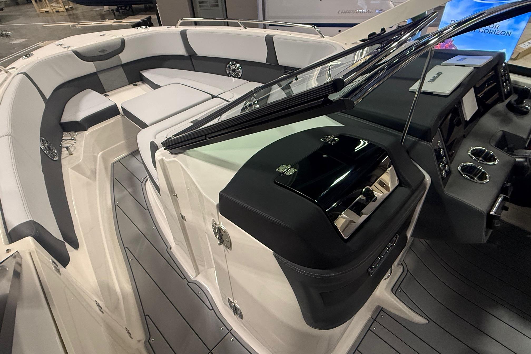 2026 Chaparral 280 OSX boat interior with sleek seating and modern dashboard design.