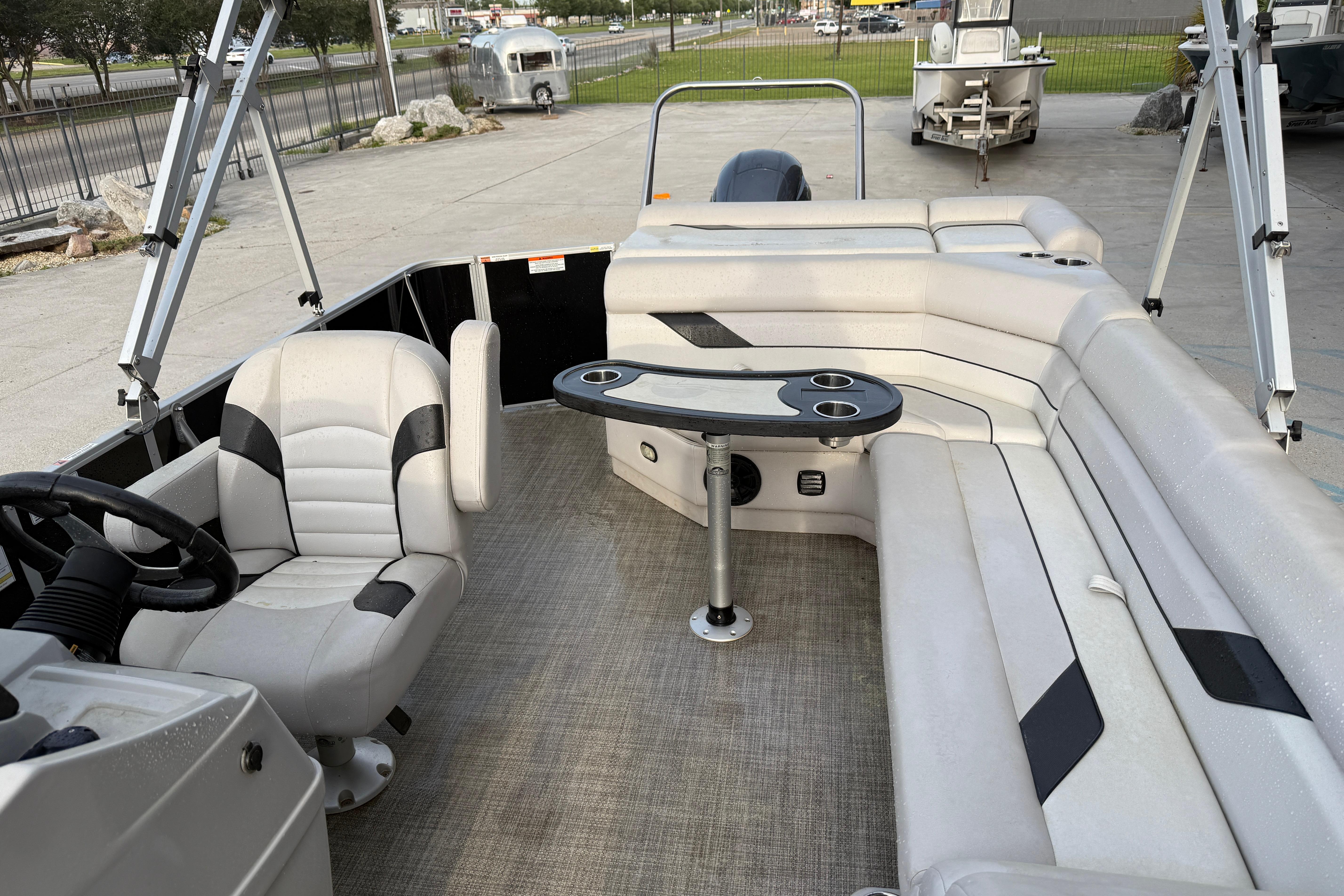 2022 Custom G3 Suncatcher 322FC pontoon boat interior with seating and table.