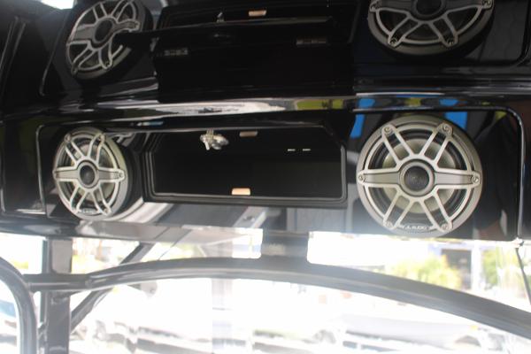 2024 Fountain 34 SC boat speakers and storage compartment, featuring sleek design and modern audio system.