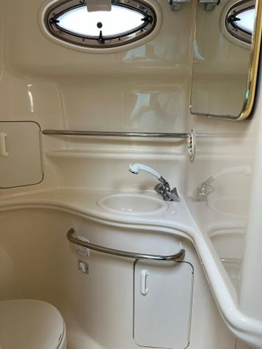 Interior of 2001 Sea Ray 340 Sundancer with sink and mirror.