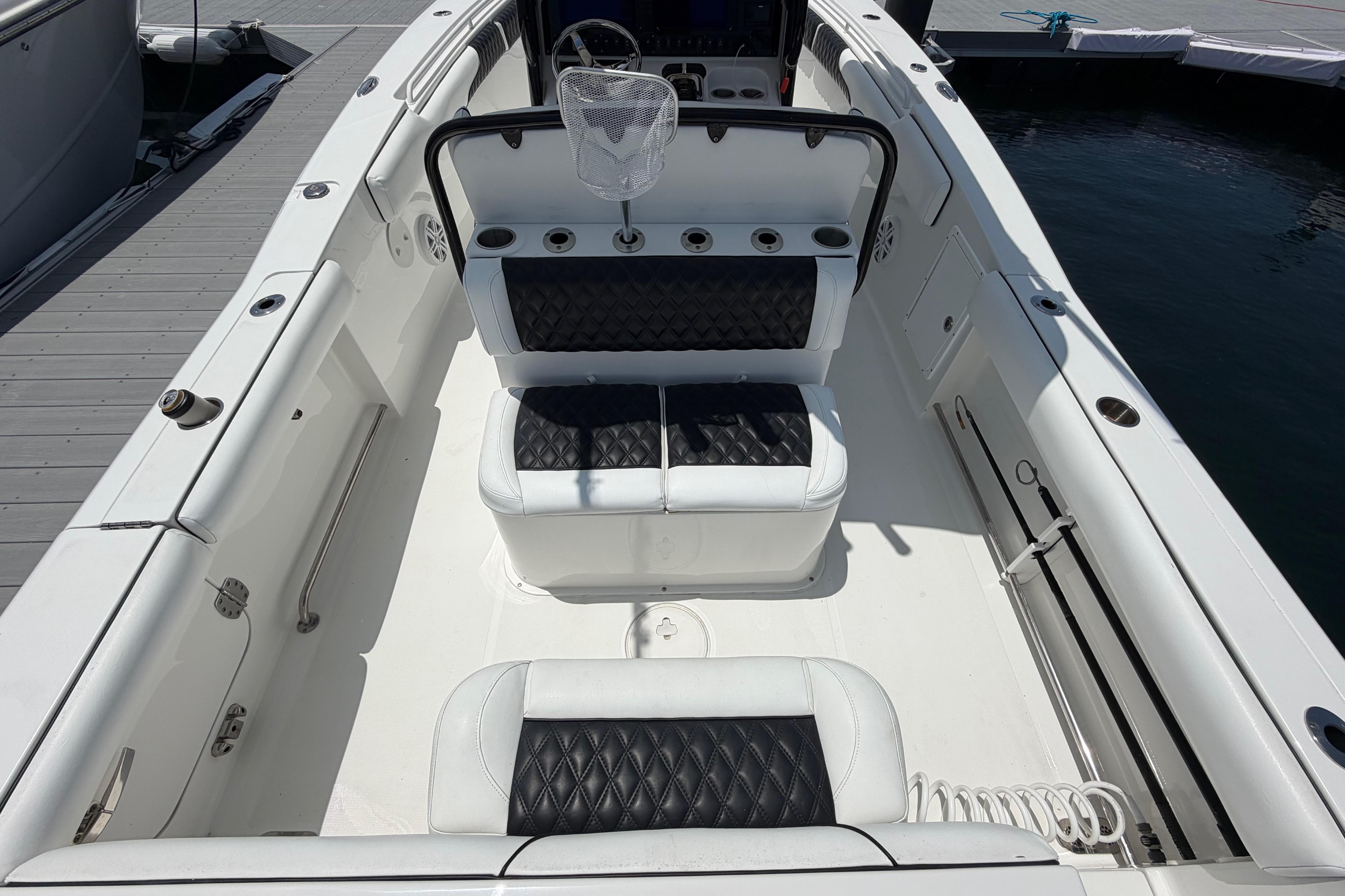 2019 Sea Hunt Gamefish 27 Coffin Box boat interior with cushioned seating.