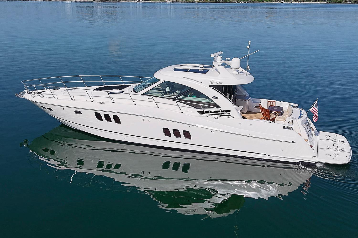 2008 Sea Ray 60 Sundancer yacht cruising on calm blue waters.