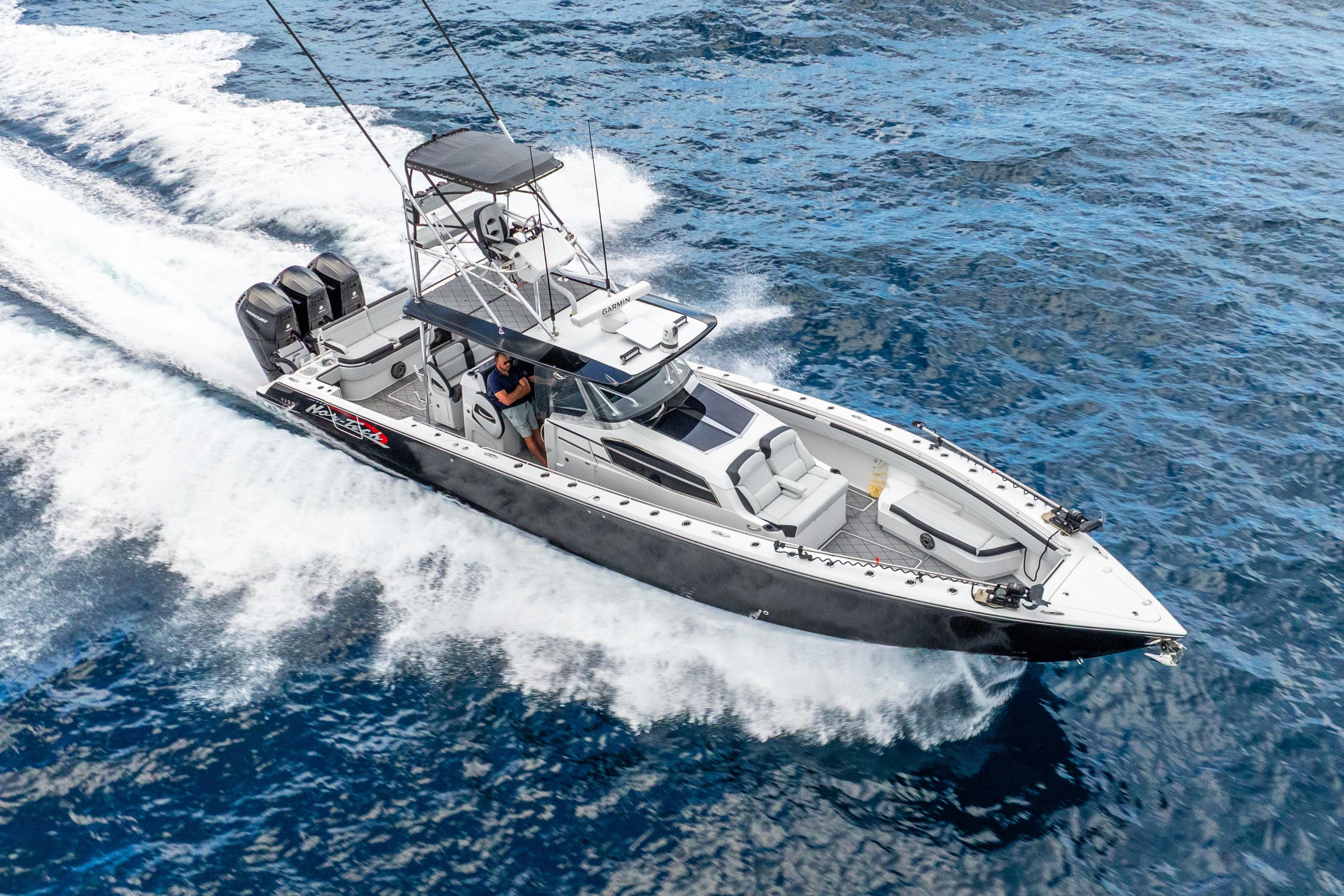 2024 Nor-Tech 452 Super Fish boat cruising on open water.