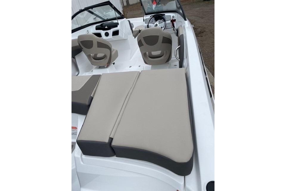 2025 Tahoe 200 S boat interior with beige seating and steering console.