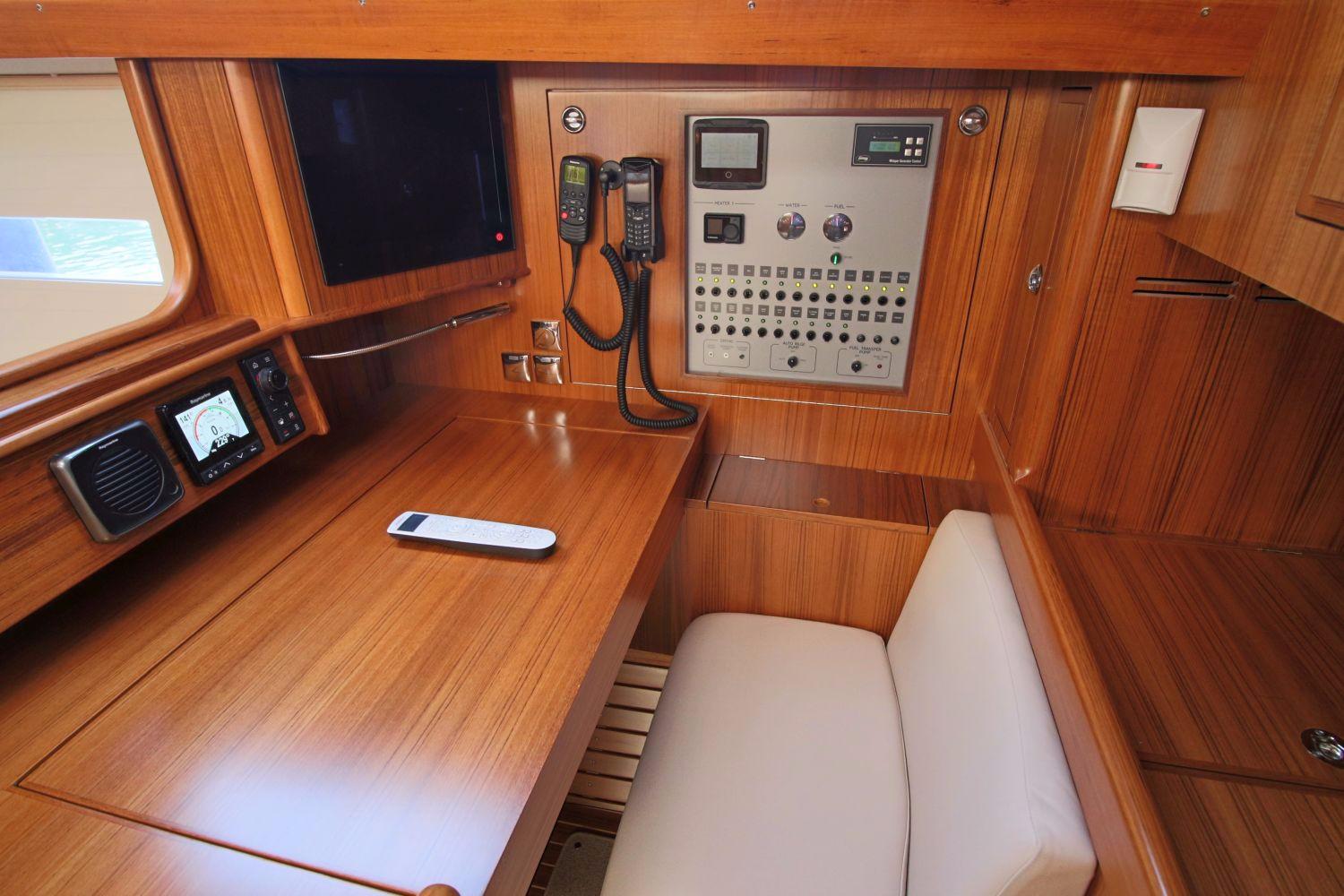 Interior of Hallberg-Rassy 48 MkII yacht, navigation area, year 2018.