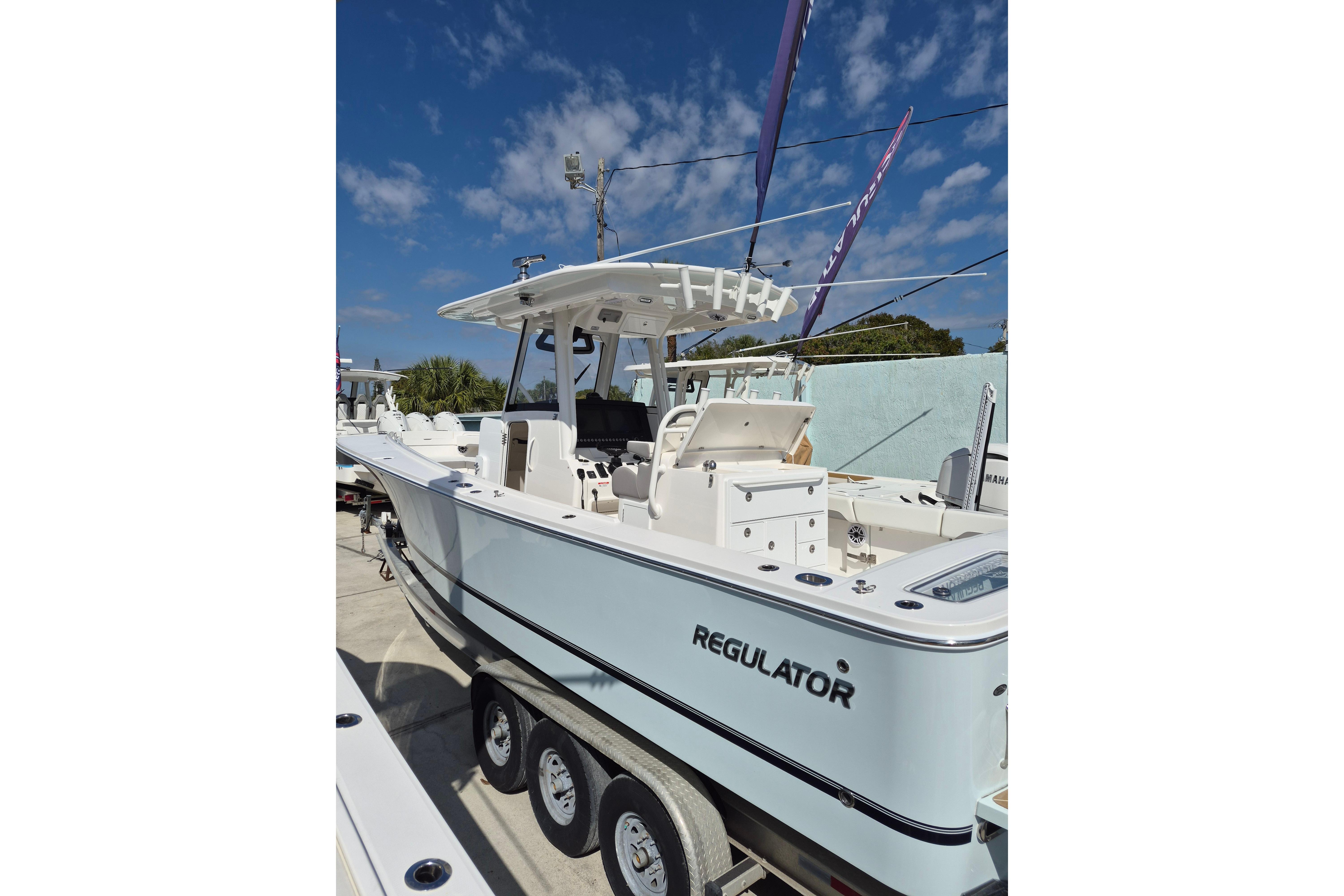 2026 Regulator 31 boat on trailer under clear blue sky.