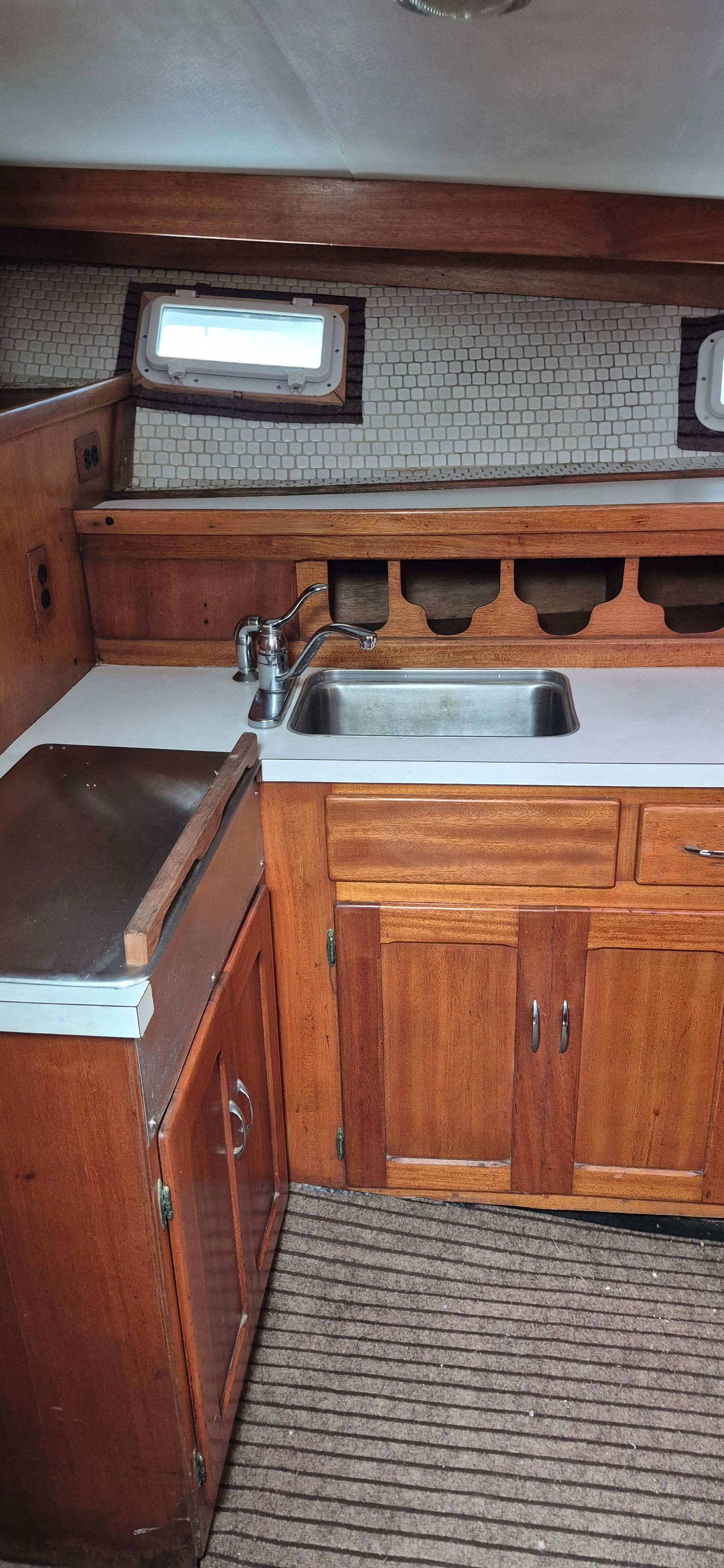 Interior of 1976 Egg Harbor 33 Sportfisher with wooden cabinetry.