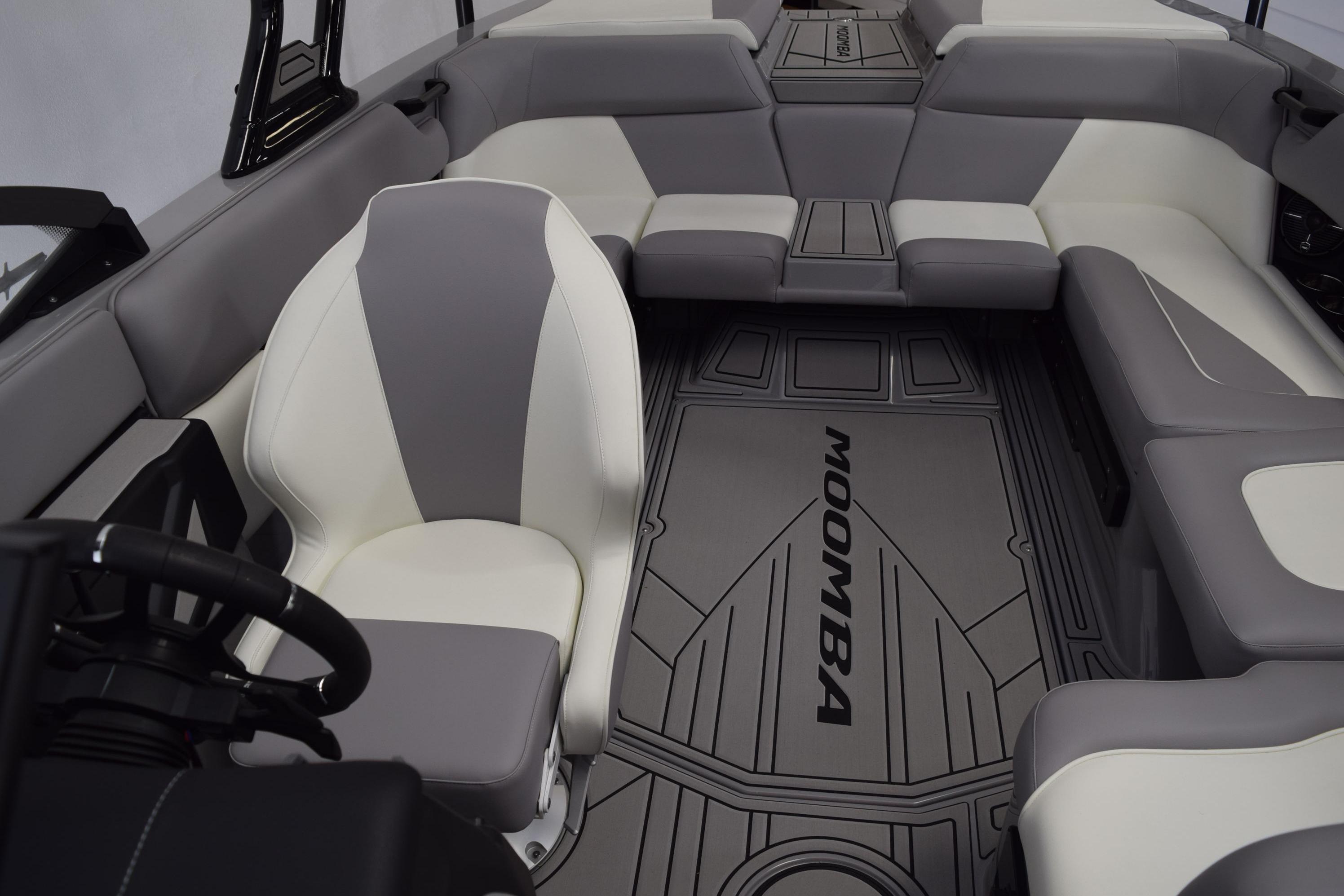 2026 Moomba Craz boat interior with gray and white seating, branded flooring.