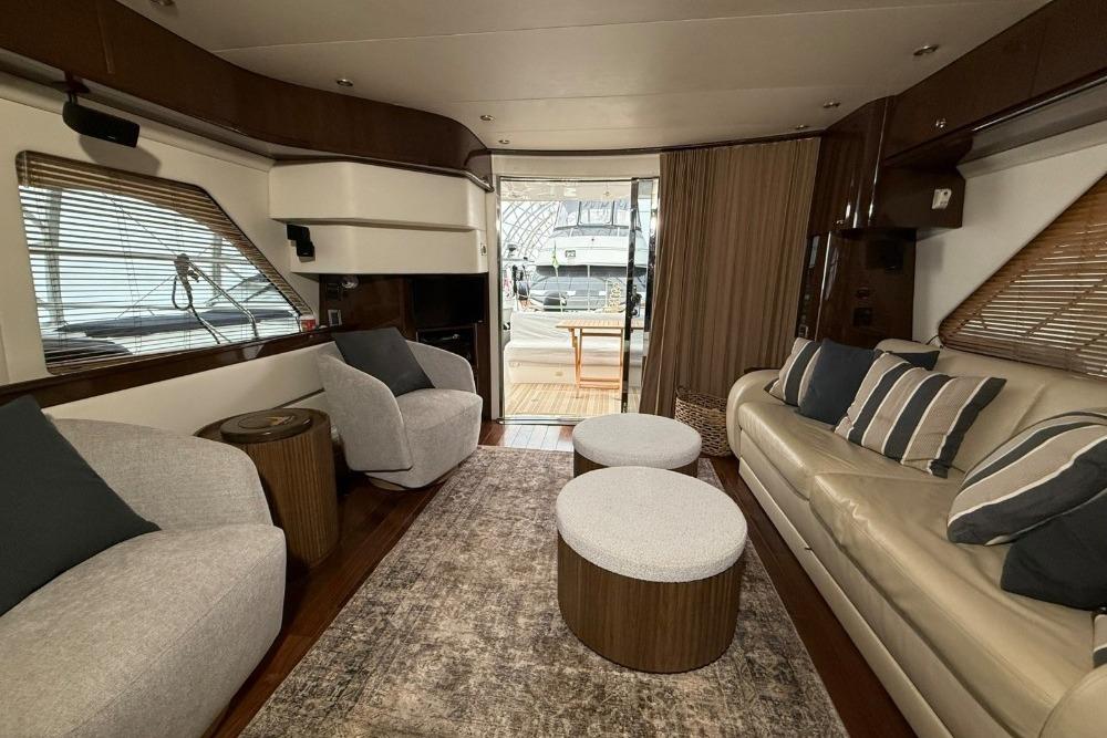 Luxurious interior of a 2007 Marquis 55 LS yacht with modern seating and decor.
