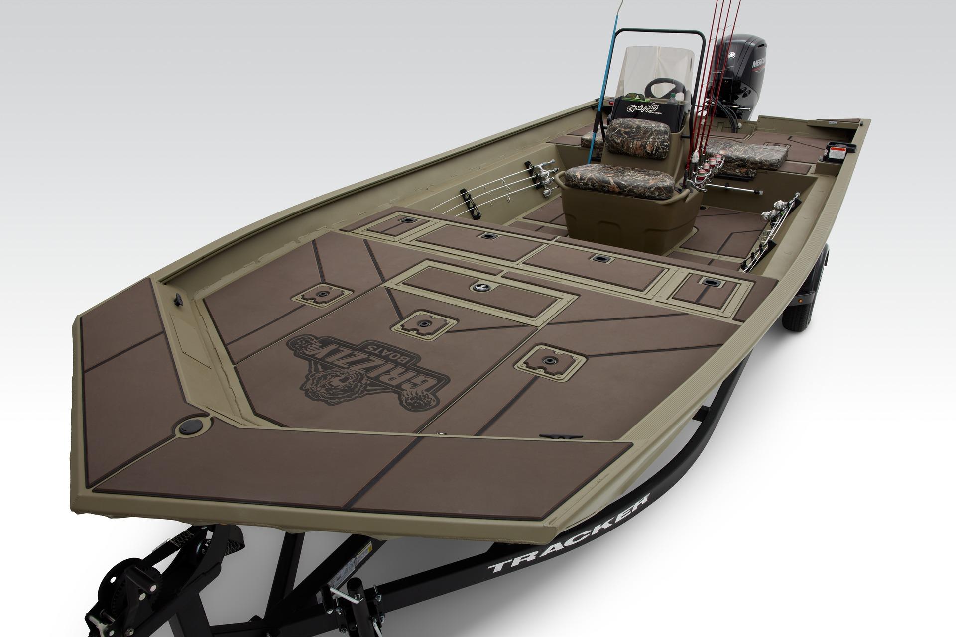 2024 Tracker Grizzly 2072 CC fishing boat with spacious deck and camouflage seating.