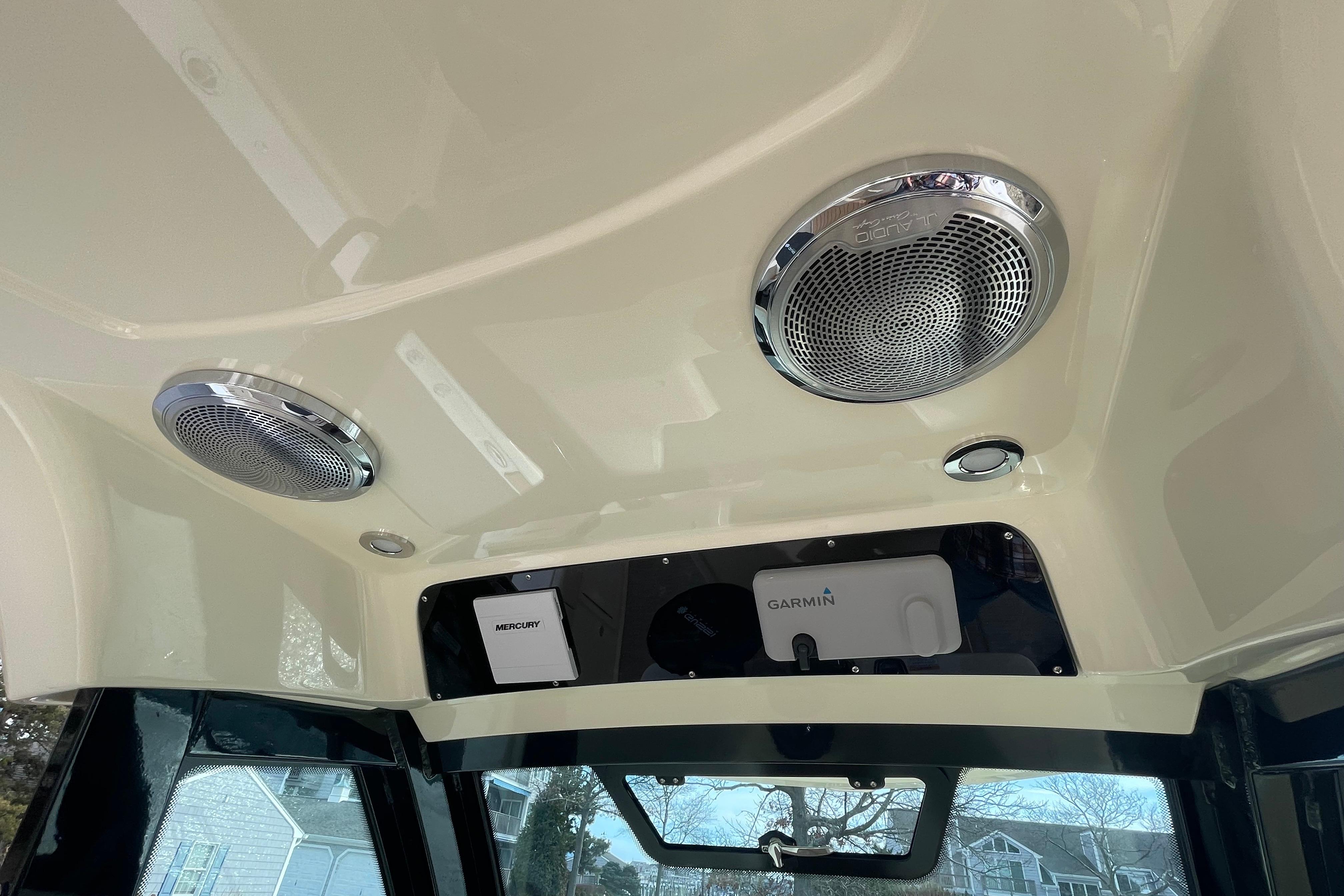 2026 Chris-Craft 310 Catalina interior with speakers and Garmin navigation system.