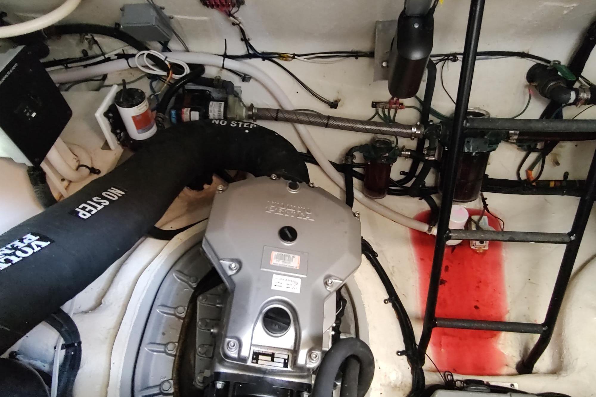 Engine room of 2021 Regal 42 Fly yacht, showcasing mechanical components and systems.