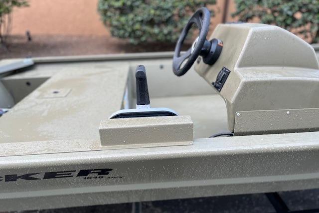 2026 Tracker Grizzly 1648 SC boat interior with steering wheel and control panel.