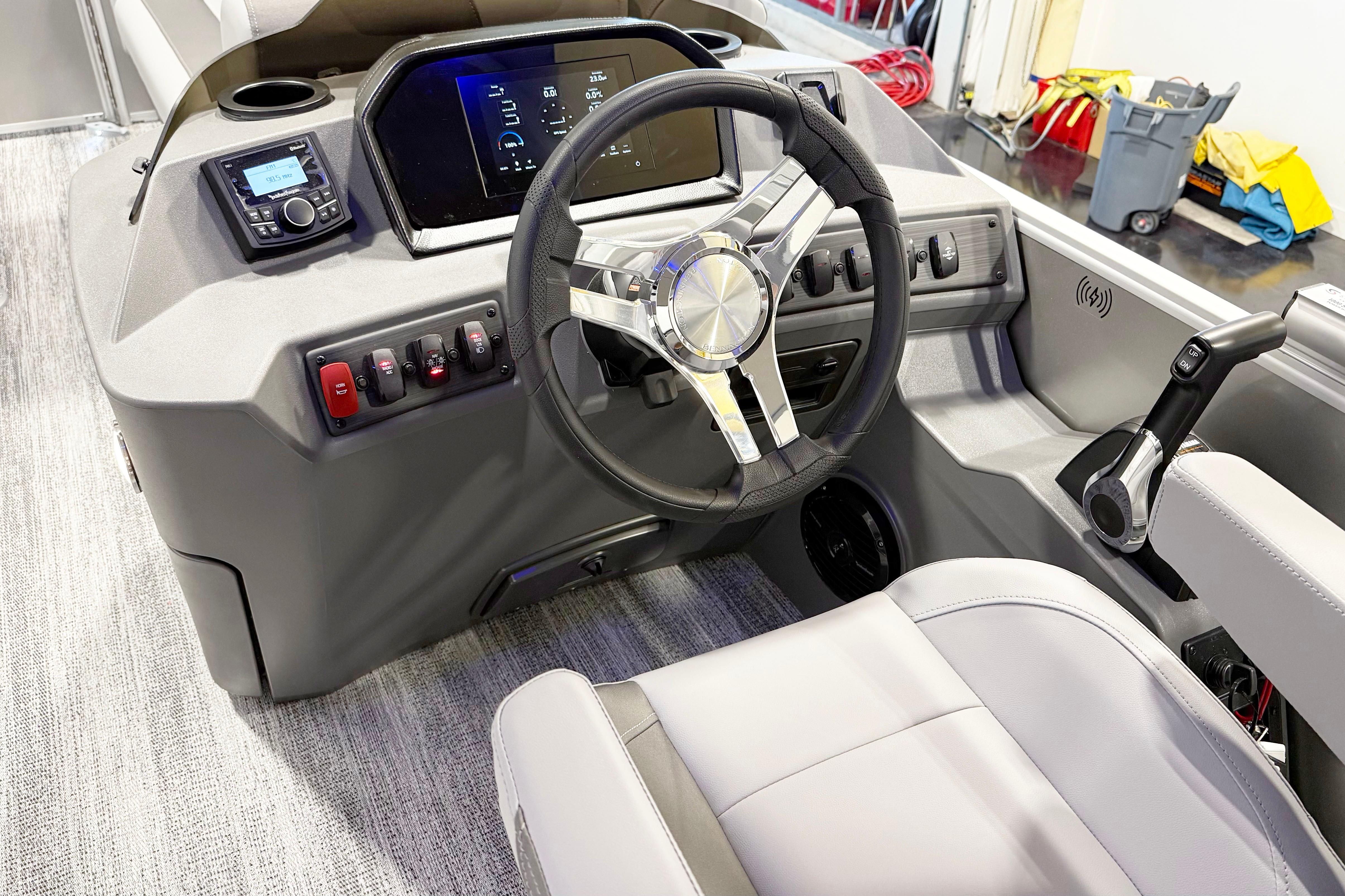 2025 Bennington 21S Cruise boat interior with modern steering wheel and control panel.