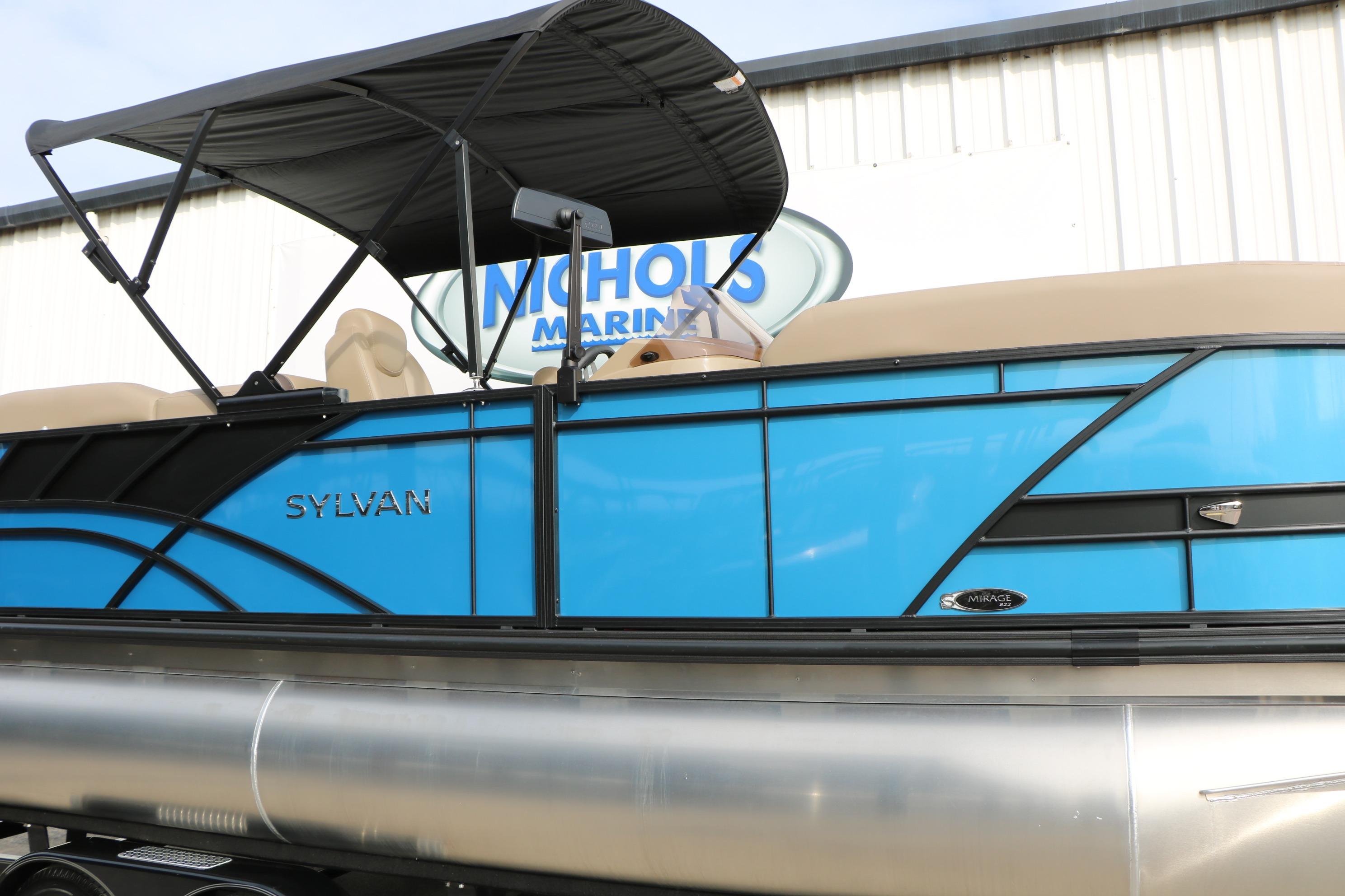 2026 Sylvan Mirage 822 LZ pontoon boat with blue exterior and black canopy.