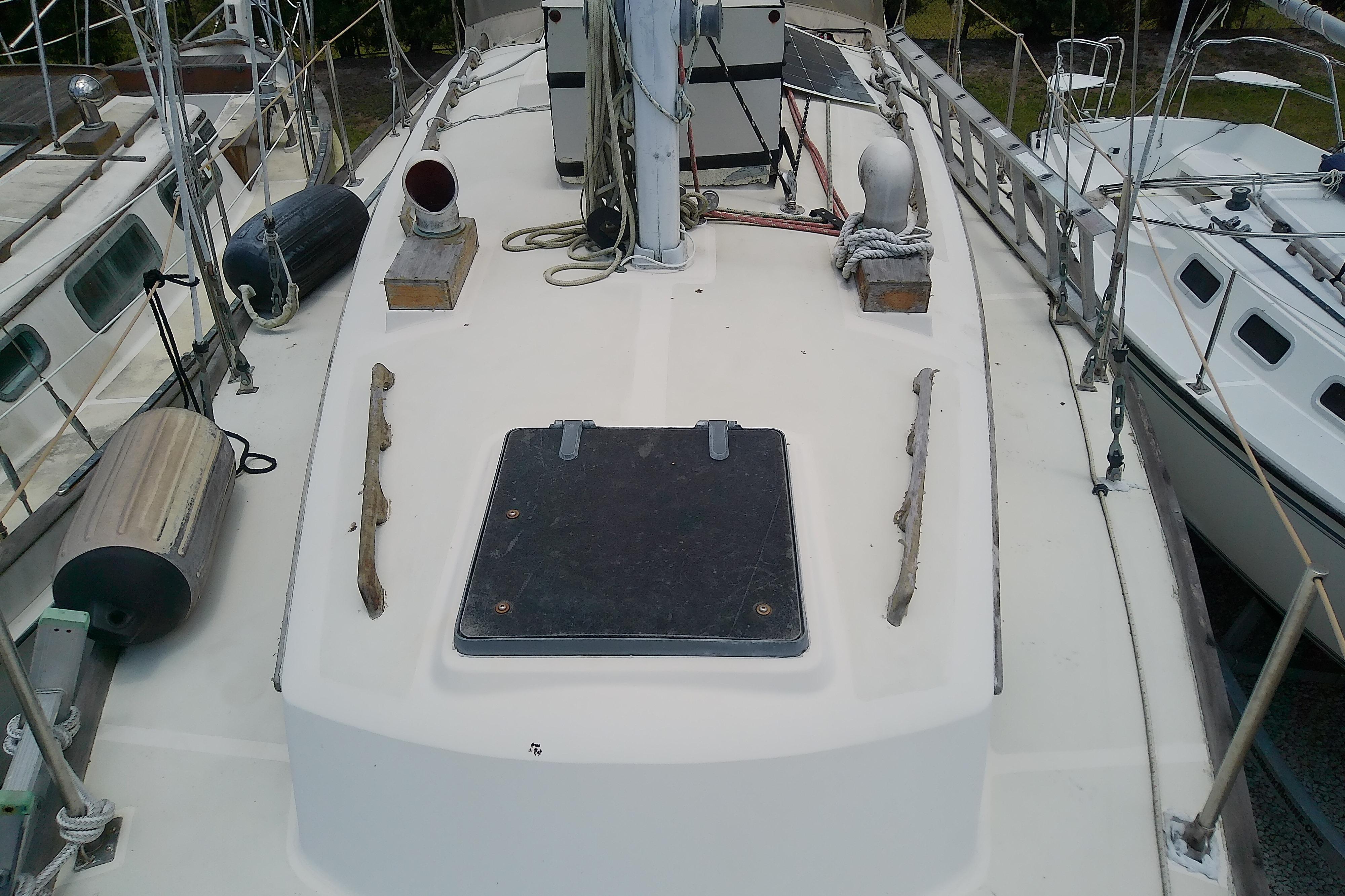 1981 Sea Sprite 34 sailboat deck with hatch, ropes, and fenders.