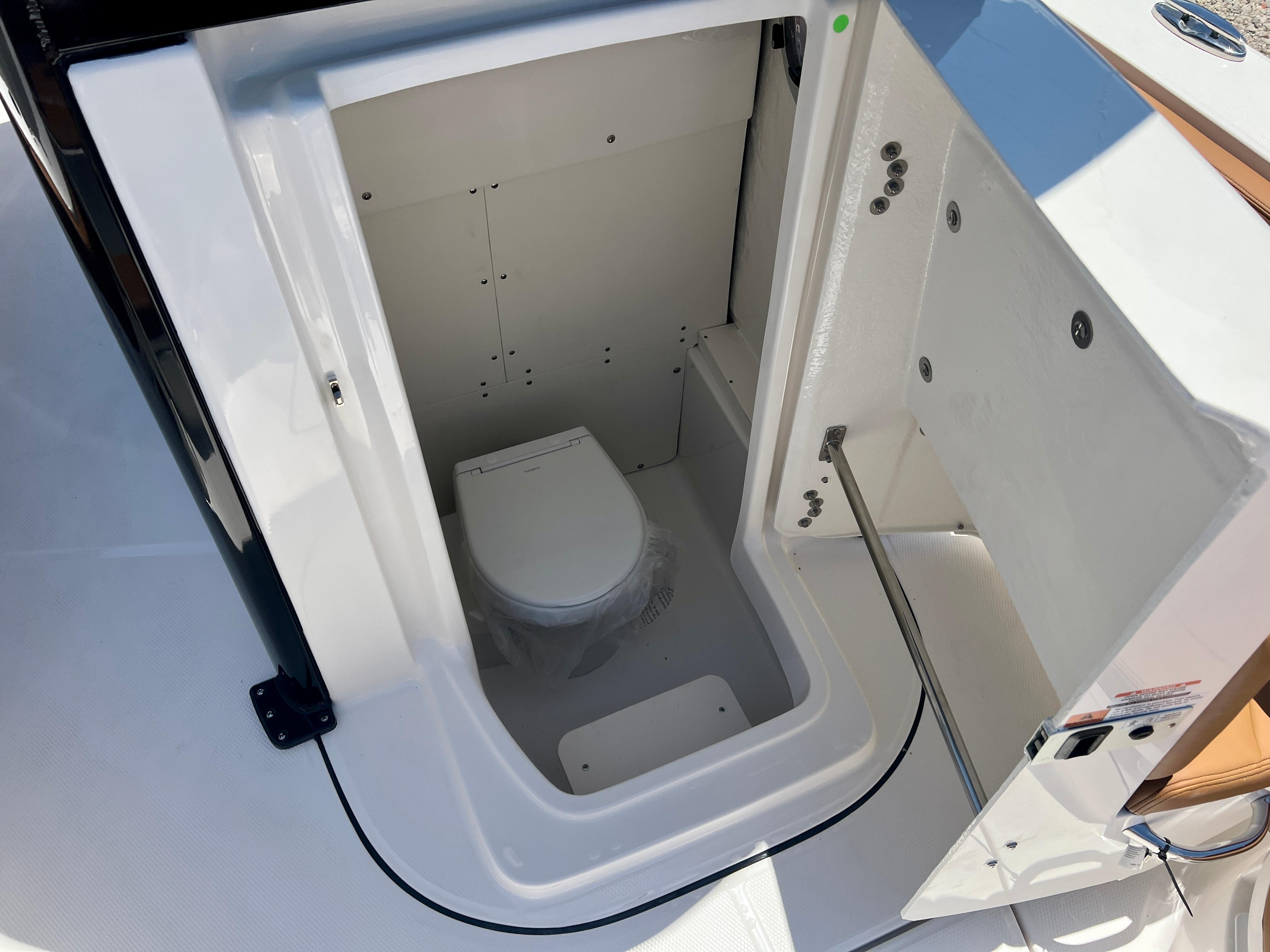 Interior view of the toilet on the 2025 Robalo 266 Cayman boat.