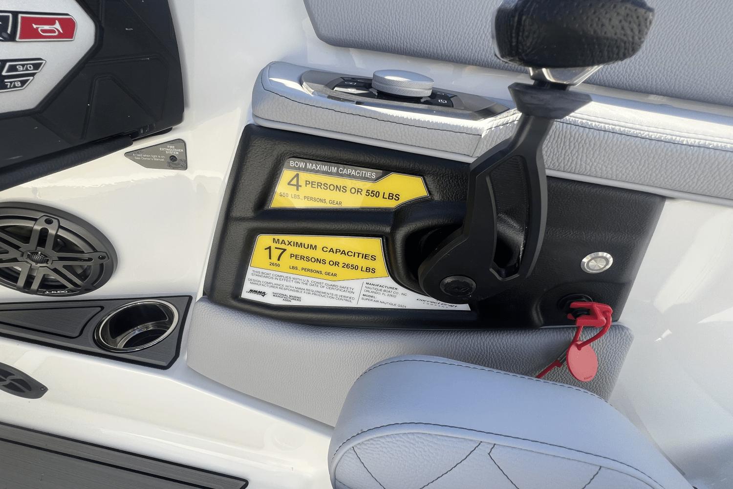 2024 Nautique Super Air Nautique GS24 boat controls and capacity labels.