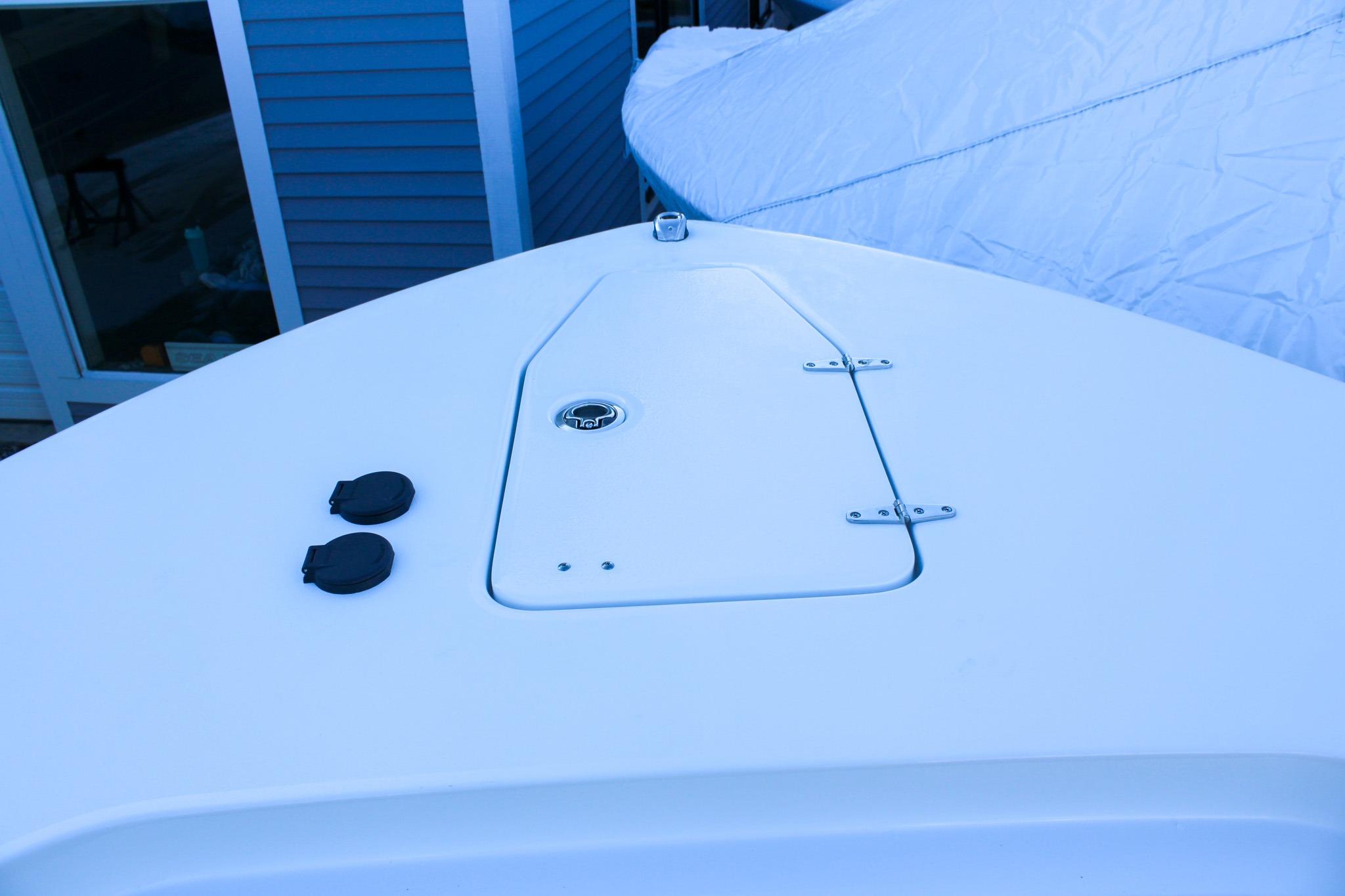 Bow deck of 2026 Sea Hunt Gamefish 25 boat with hatch and fittings.