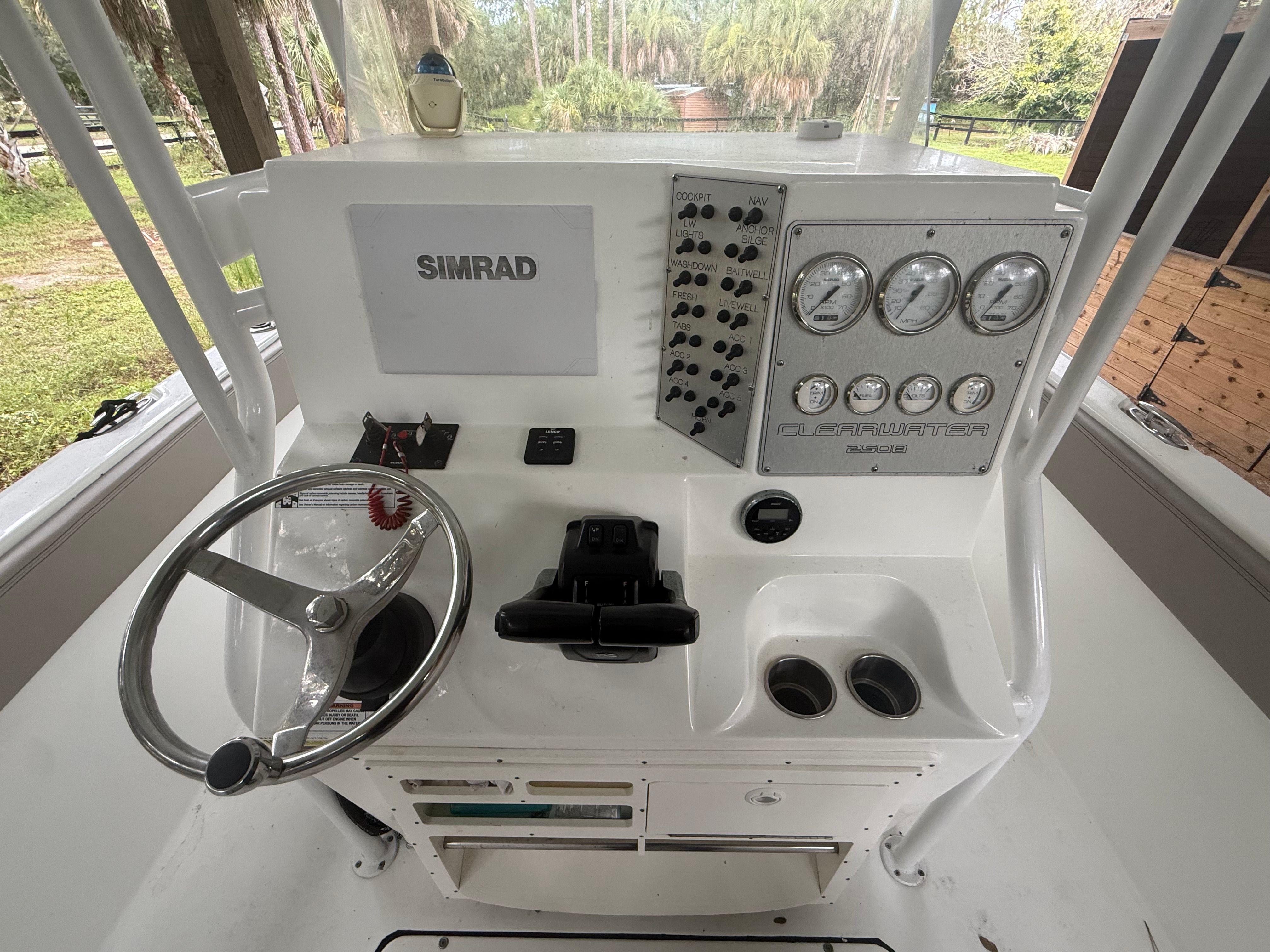 The image shows the helm of a 2021 Clearwater 2508 Center Console boat.