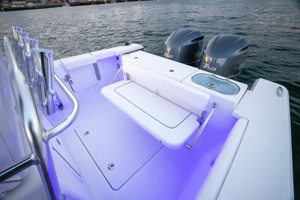 Manufacturer Provided Image: 2025 Southport 27 FE boat with dual engines and illuminated seating area.