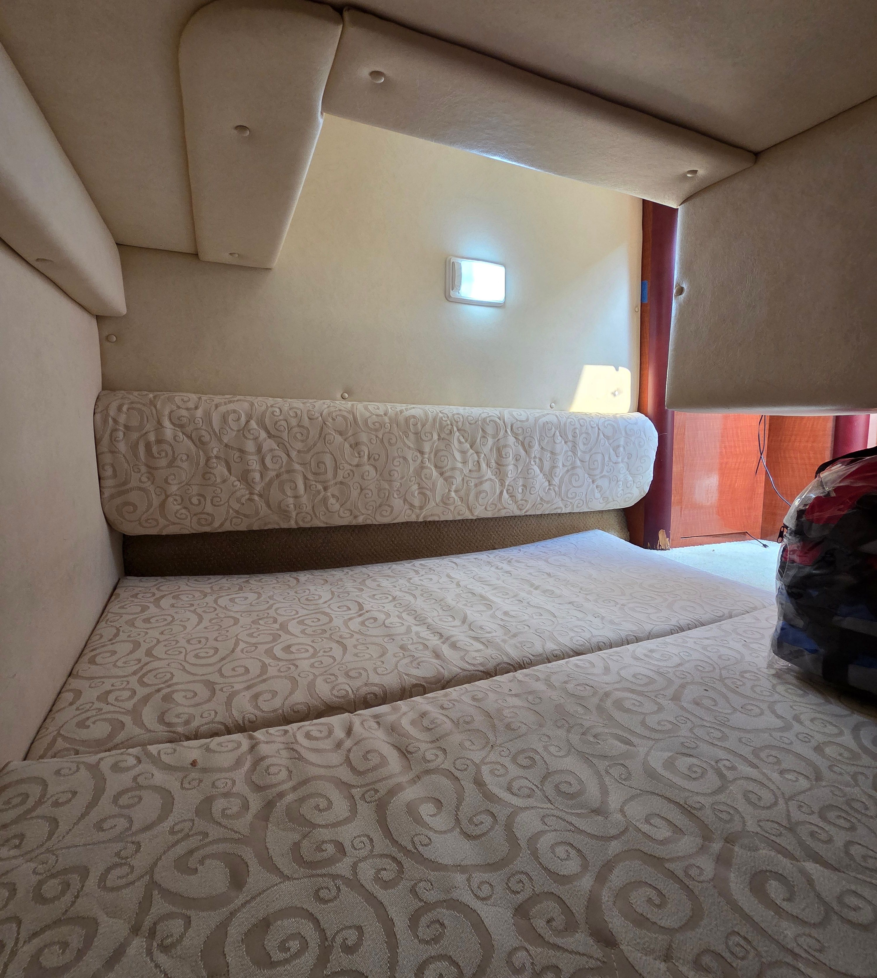 Interior of the 2005 Sea Ray Sundancer 260 with cushioned seating.