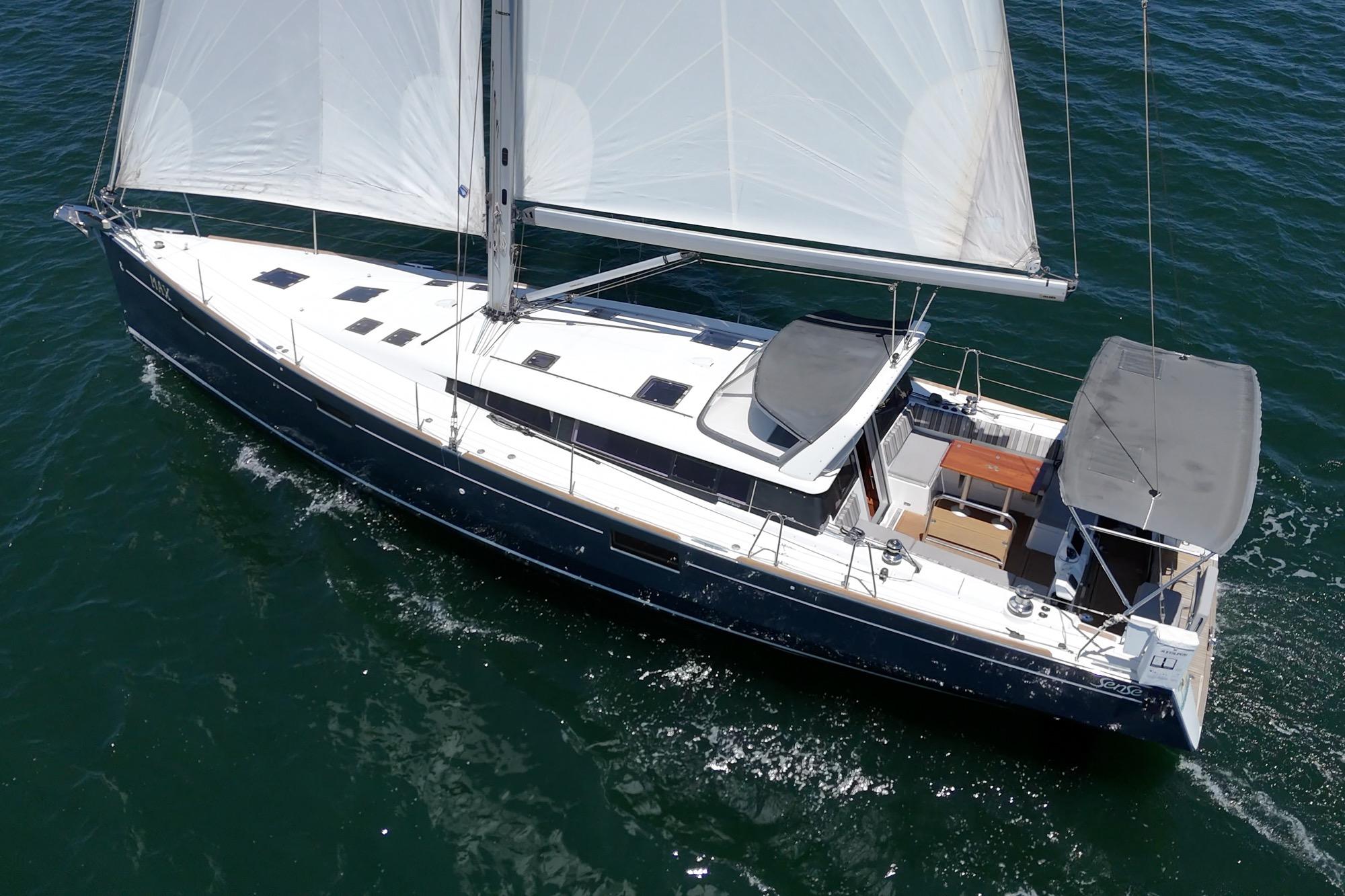 2017 Beneteau Sense 50 sailing yacht cruising on open water.