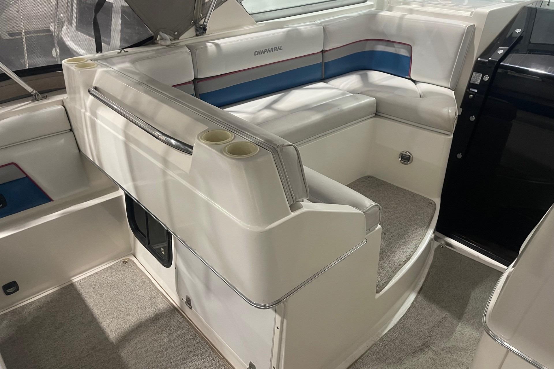 1992 Chaparral Signature 30 boat interior with white seating and blue accents.