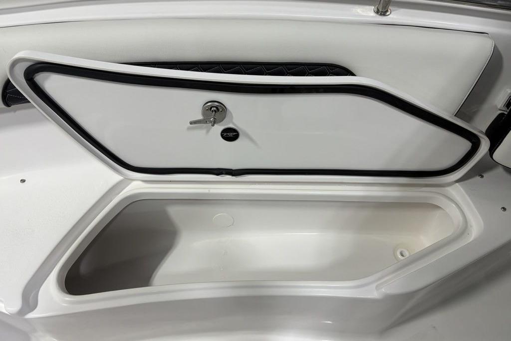 Storage compartment on 2026 Tidewater 232 CC Adventure boat, featuring secure lock and sleek design.