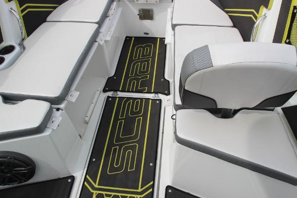 2023 Scarab 255 Open ID boat interior with seating and branded flooring.