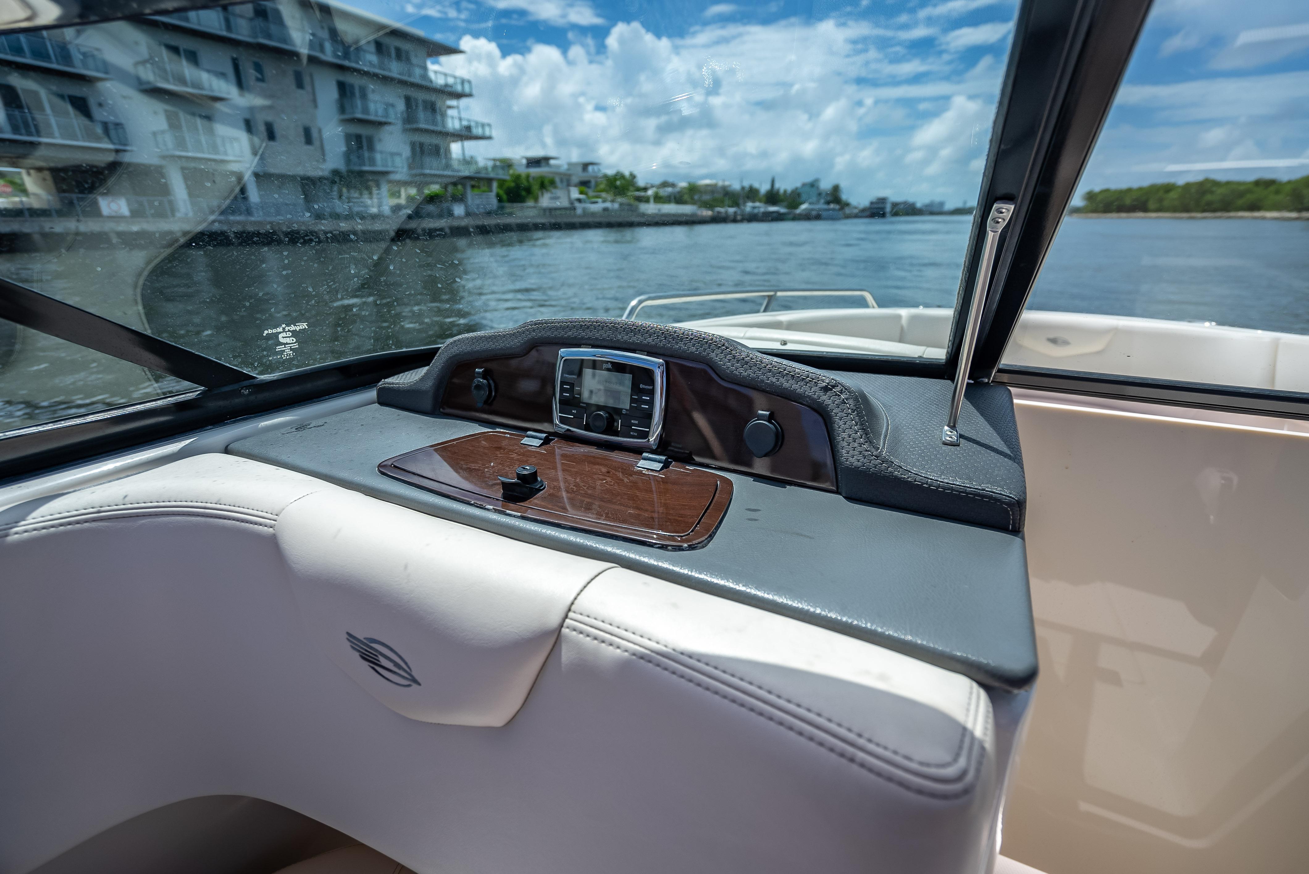 2017 Chaparral 227 SSX boat dashboard with water view and modern controls.