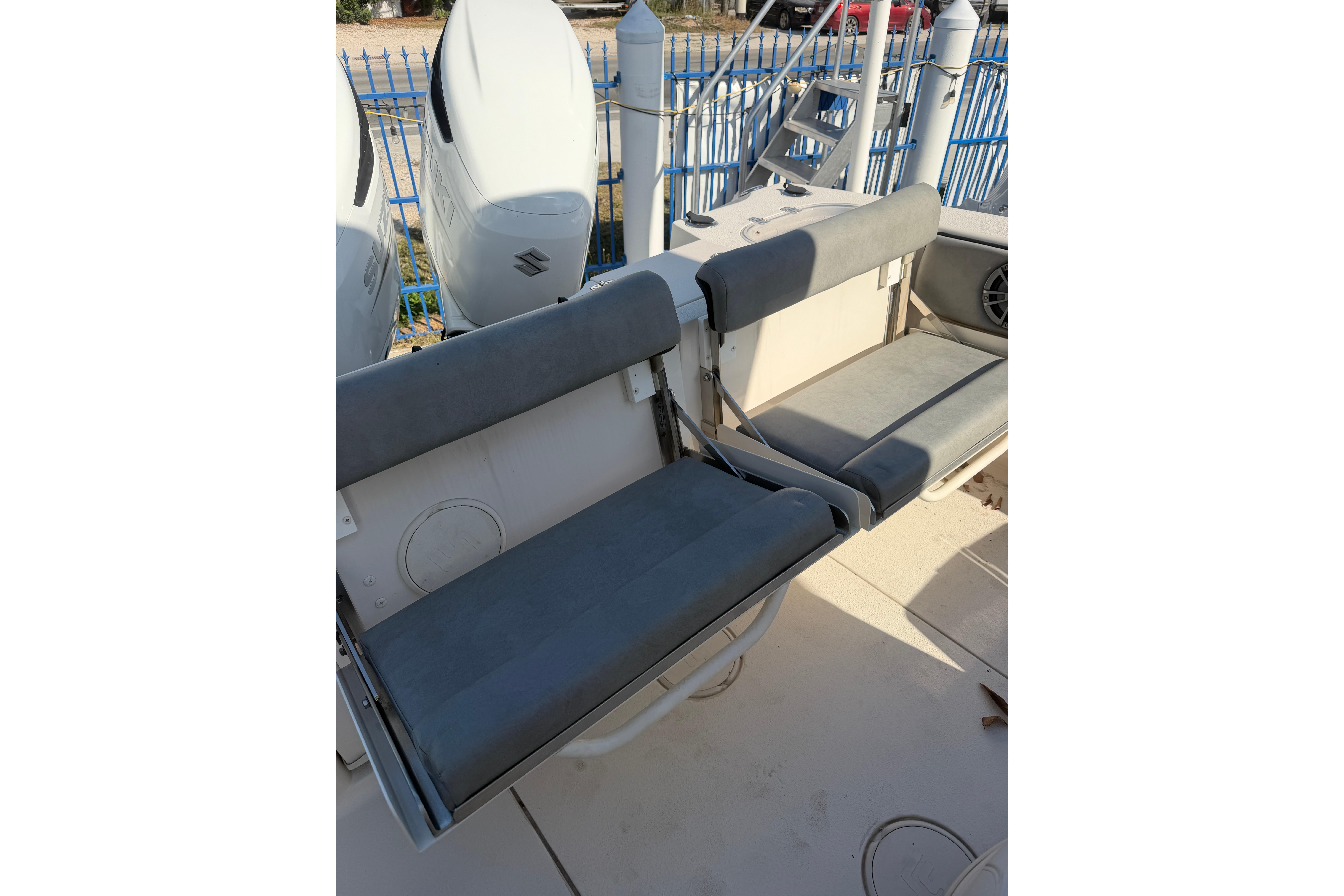 2023 Sea Chaser 27 HFC CC boat seating area with dual outboard engines.