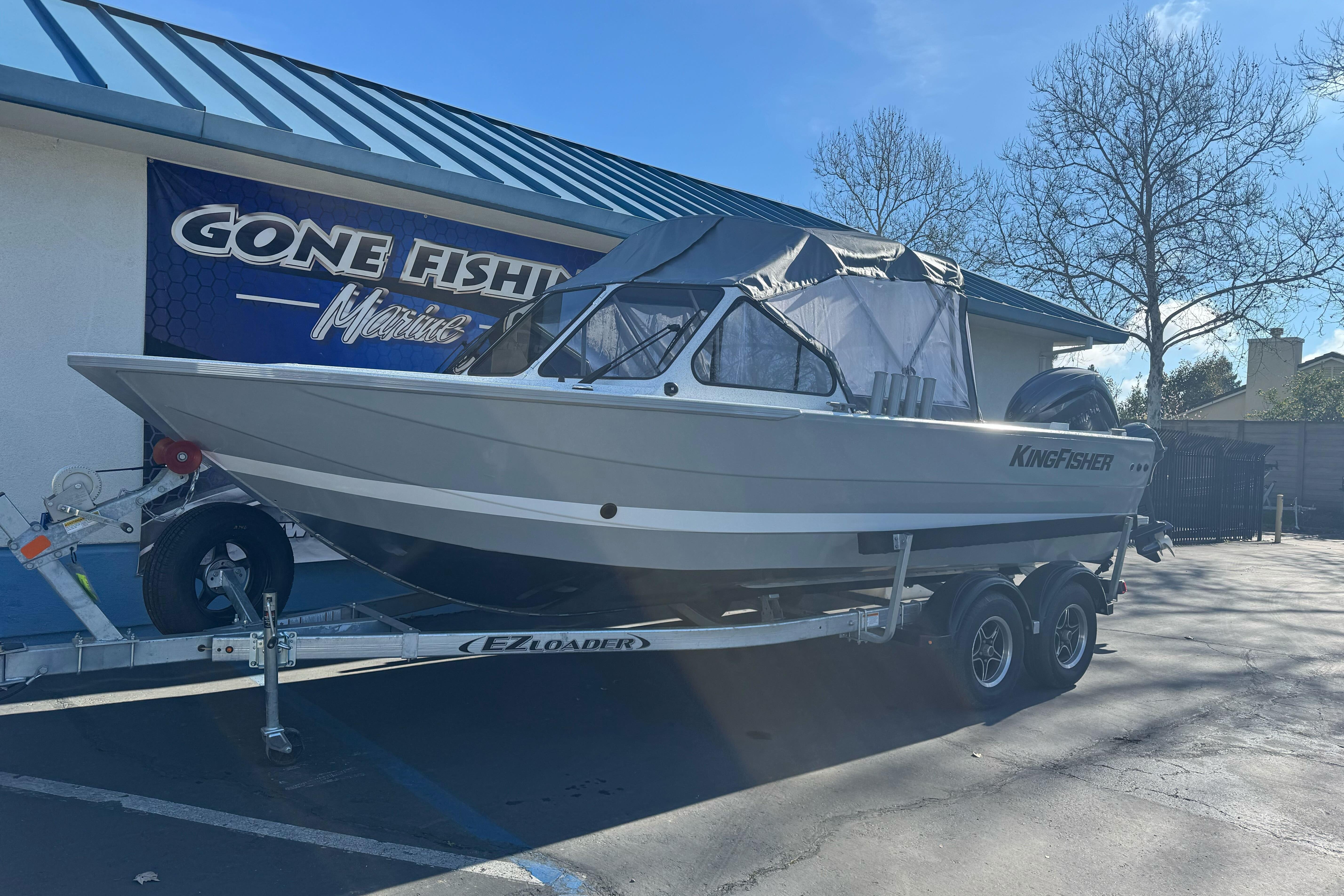 KingFisher 2025 Escape boat on trailer at Gone Fishing Marine dealership.