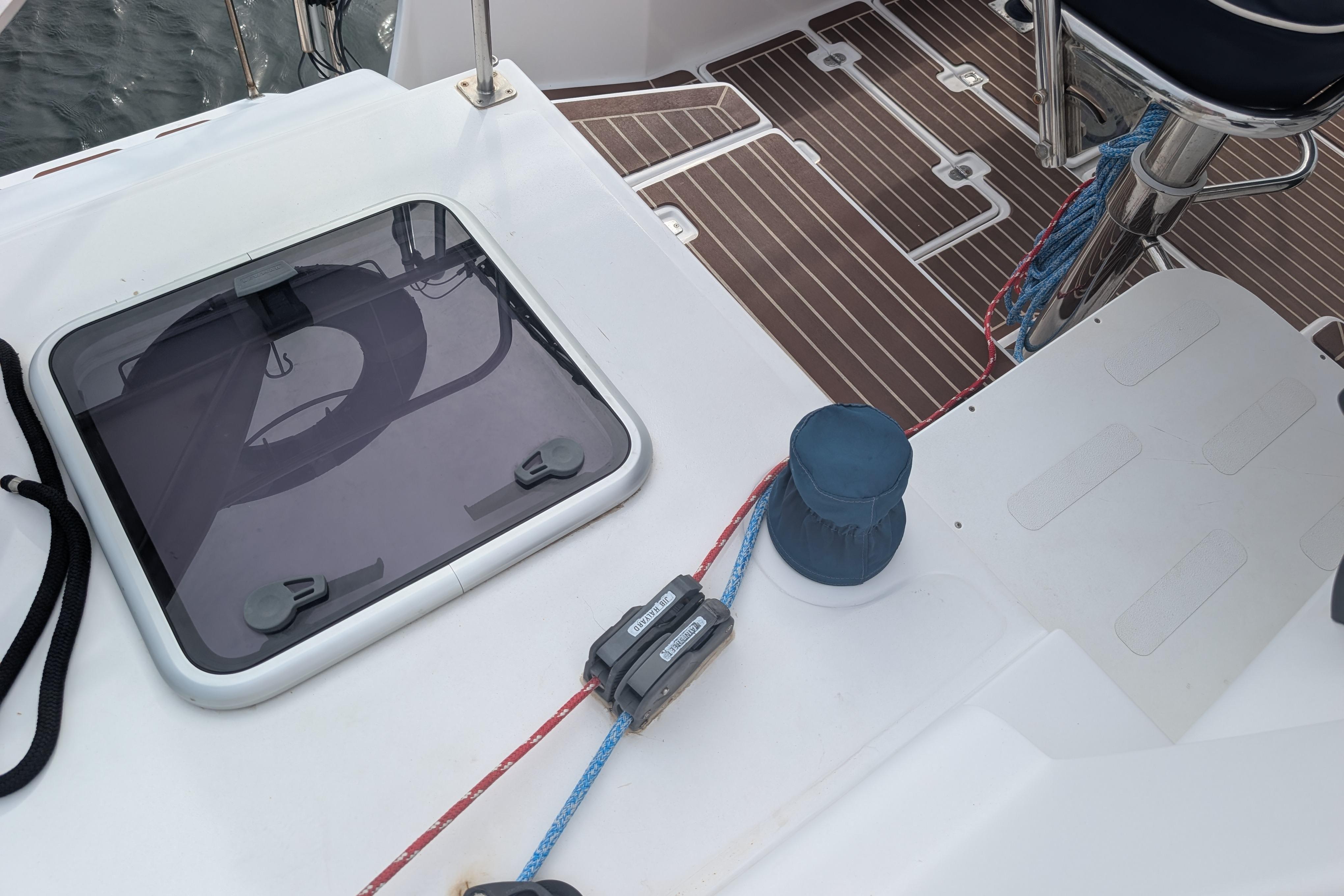 Deck of 1999 Island Spirit 37 sailboat with hatch and winch.