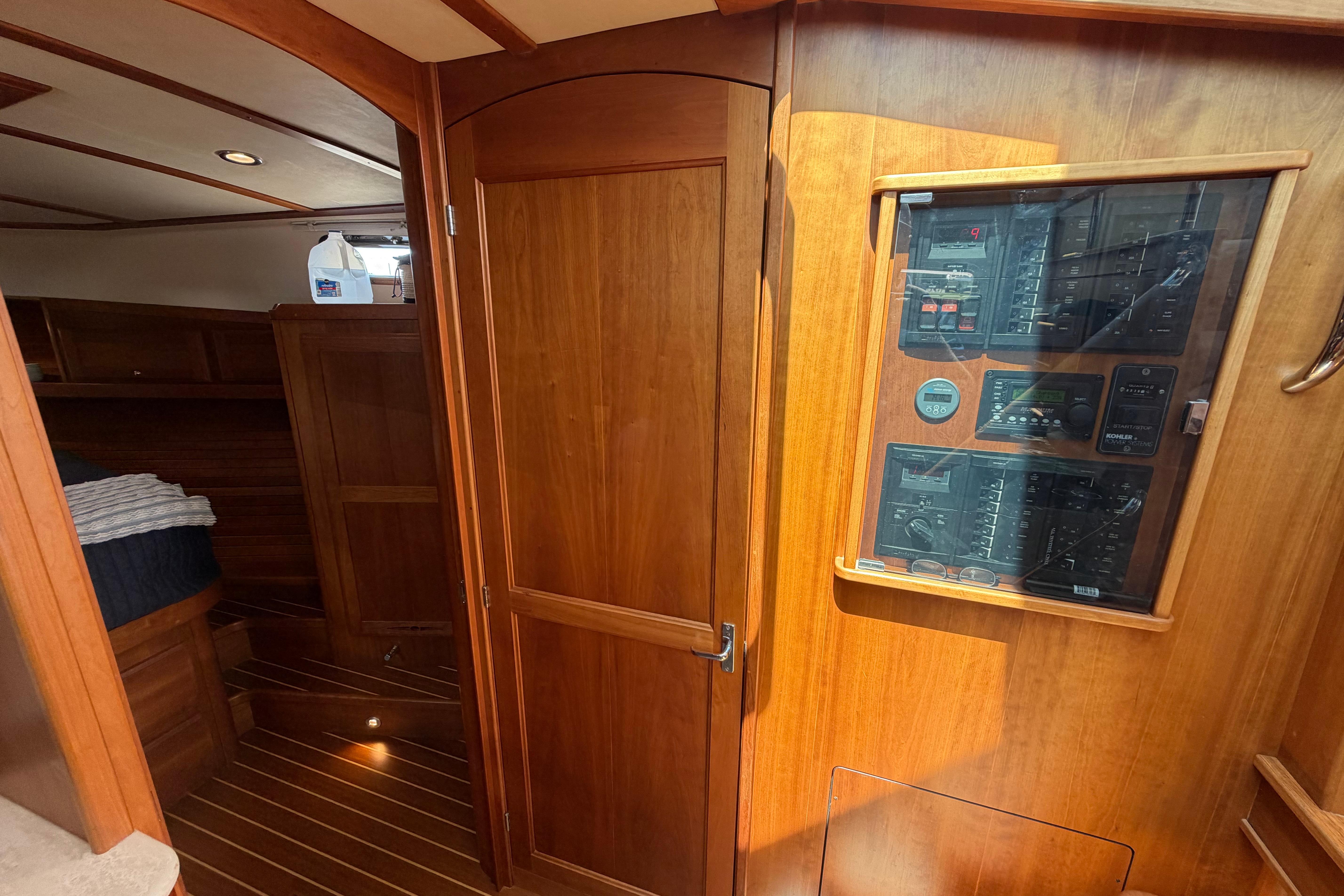 2015 Sabre 38 Salon Express interior with wooden cabinetry and control panel.