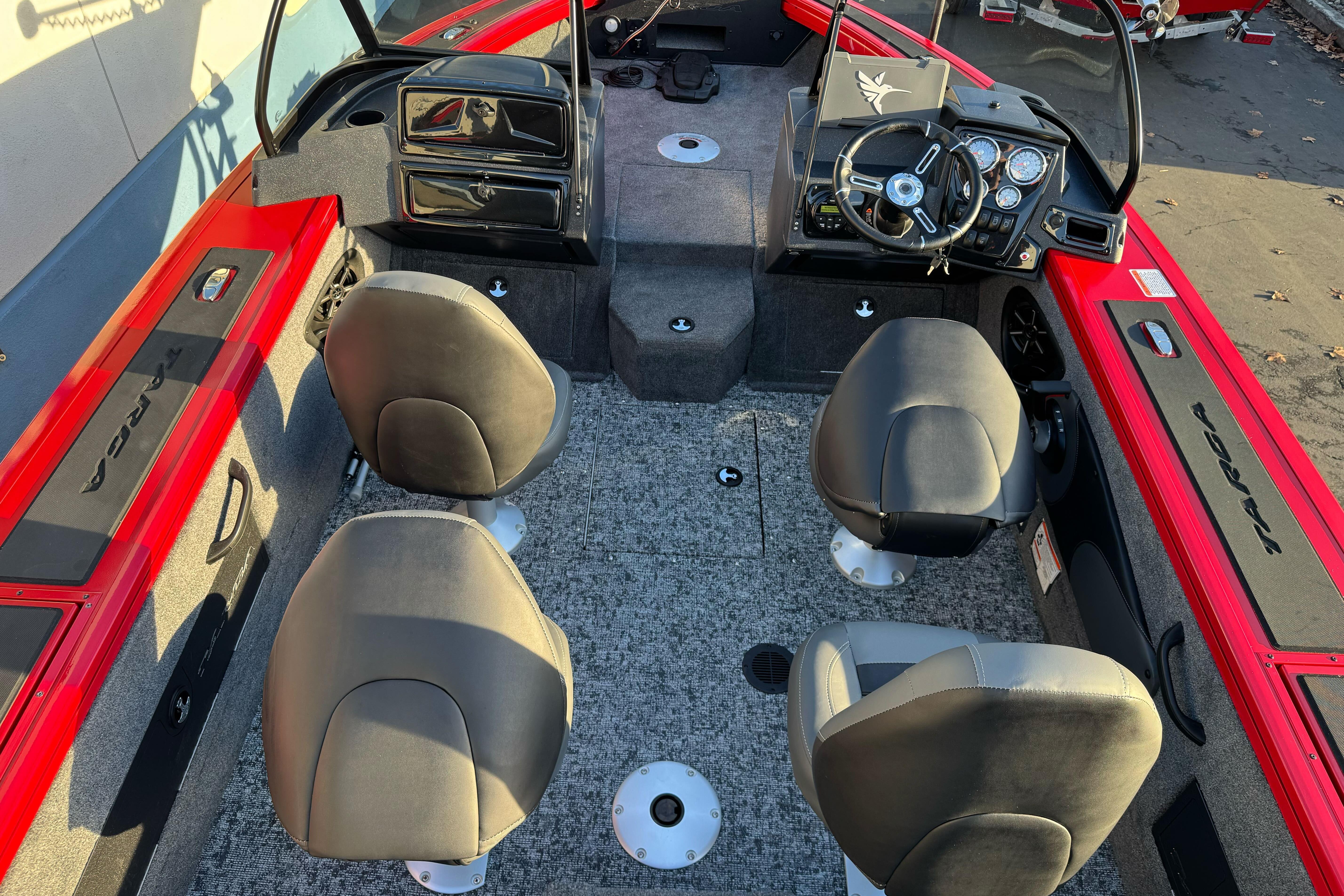 2026 Tracker Targa V-18 WT boat interior with four seats and modern dashboard.