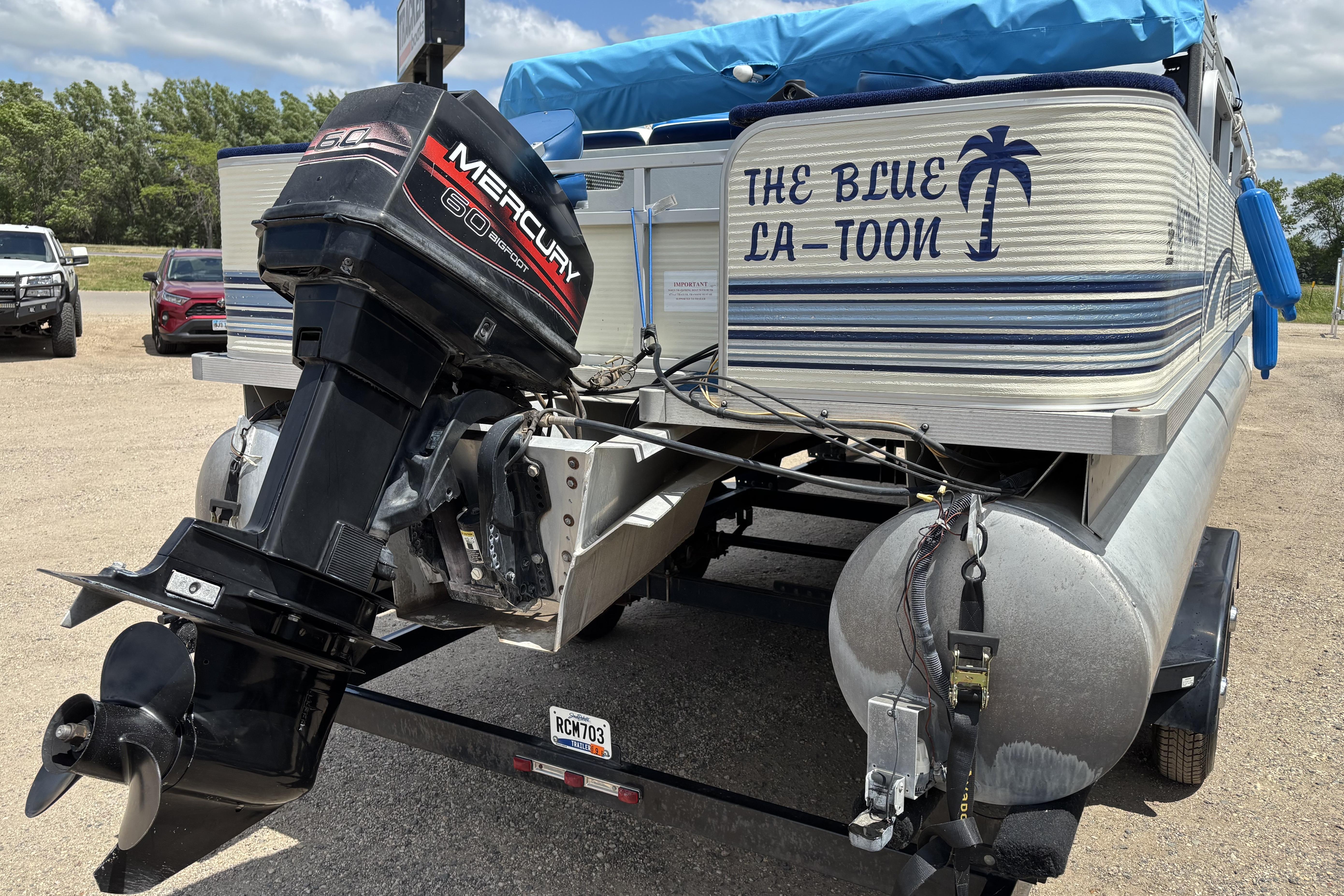 1997 Northwood 24' Pontoon boat with Mercury outboard motor, labeled "The Blue La-Toon."