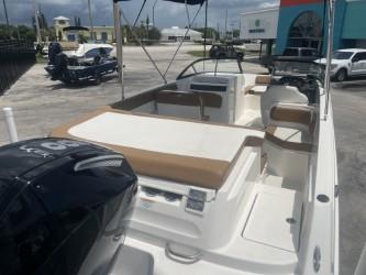 2022 Bayliner VR6 boat with spacious seating and modern design, parked outdoors.