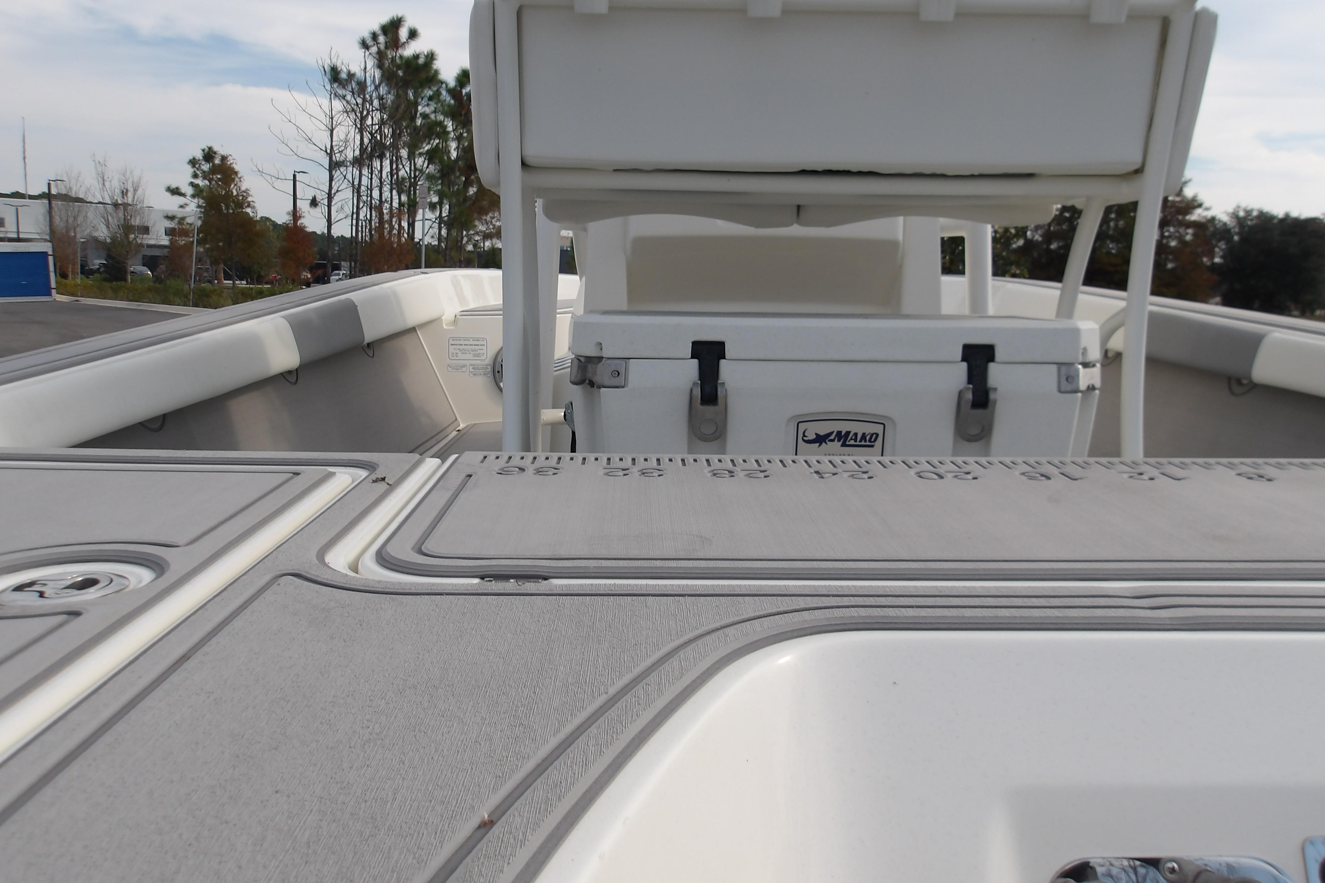 2026 Mako 24 APEX boat interior with seating and storage compartments.