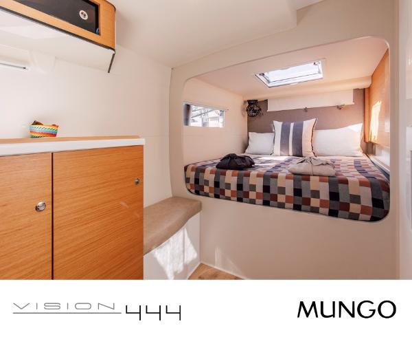 Cozy cabin interior of Vision 444 yacht, featuring a comfortable bed and modern design.