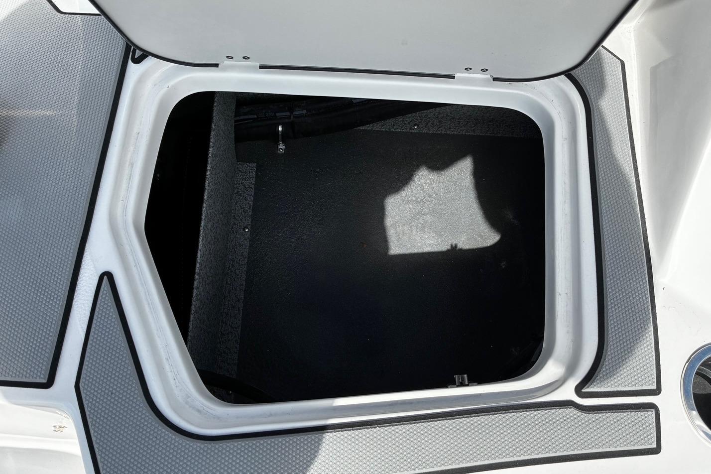 Open storage compartment on 2026 Starcraft SV 16 OB boat.