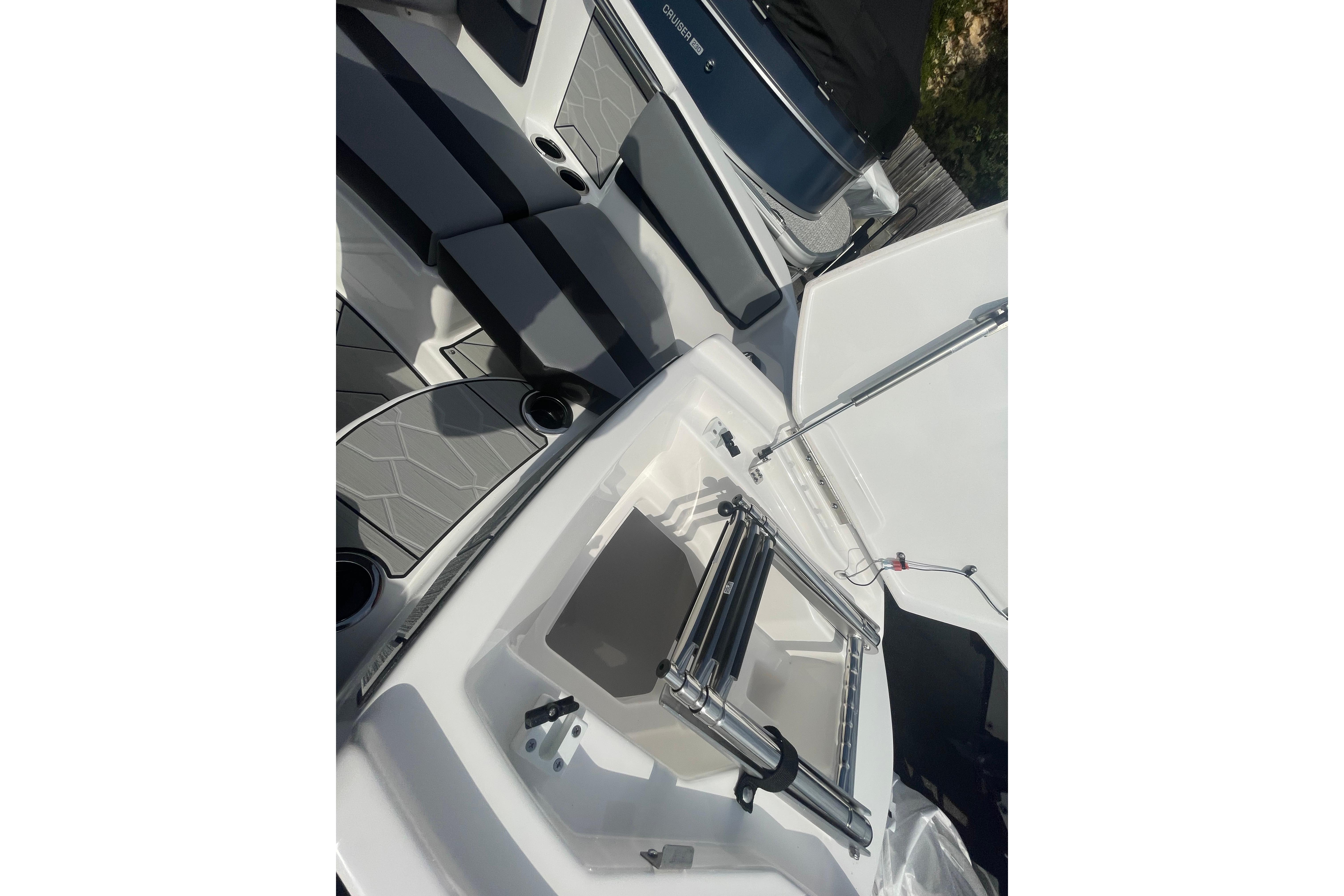 2026 Yamaha Boats 222XD interior with seating and storage compartments.