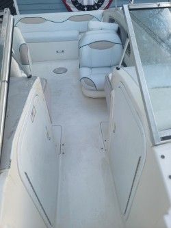 Interior of a 1996 Wellcraft 2400S boat with white seating.