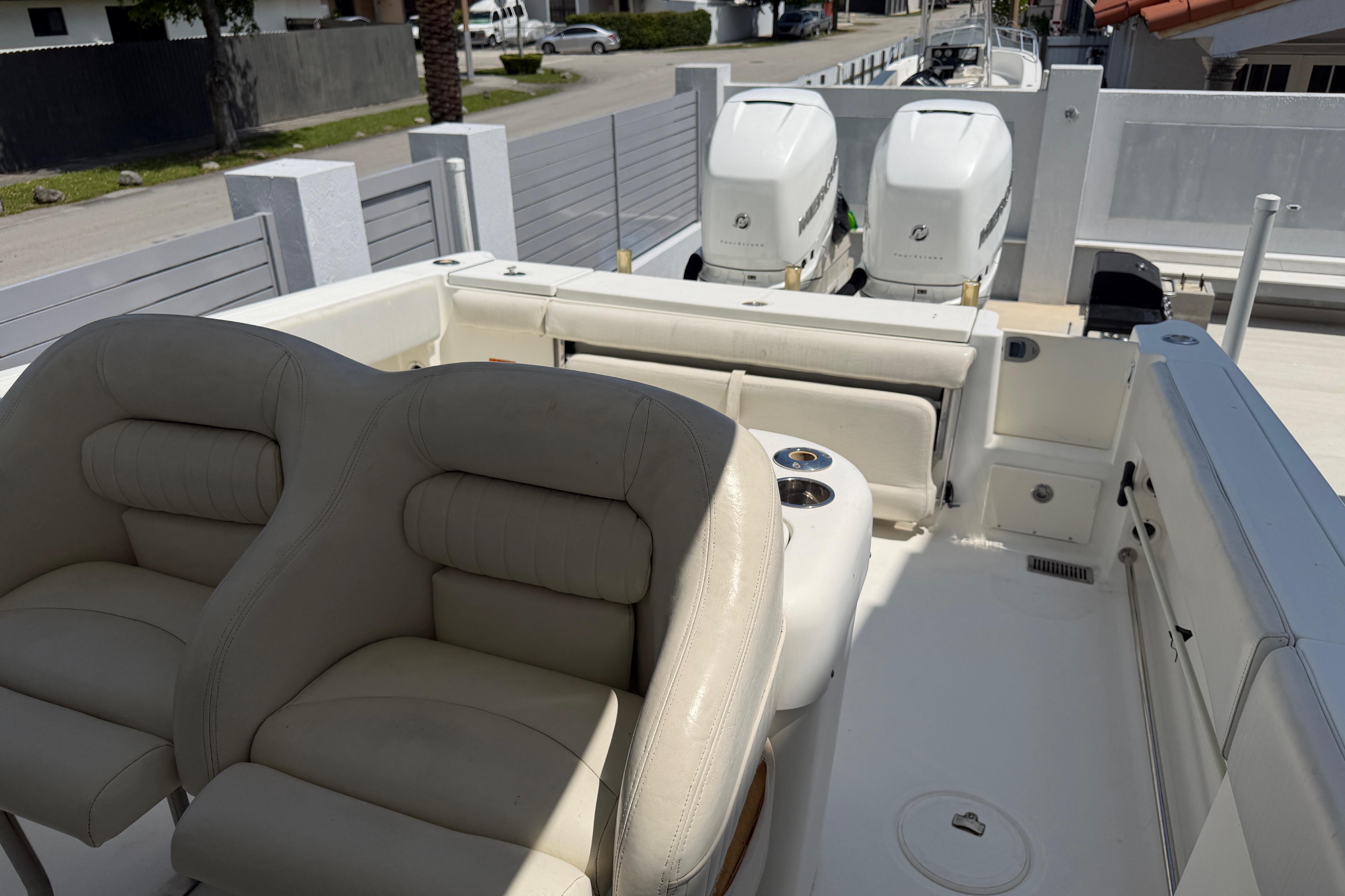 2008 Hydra-Sports Vector 2900 CC boat interior with dual engines and cushioned seating.
