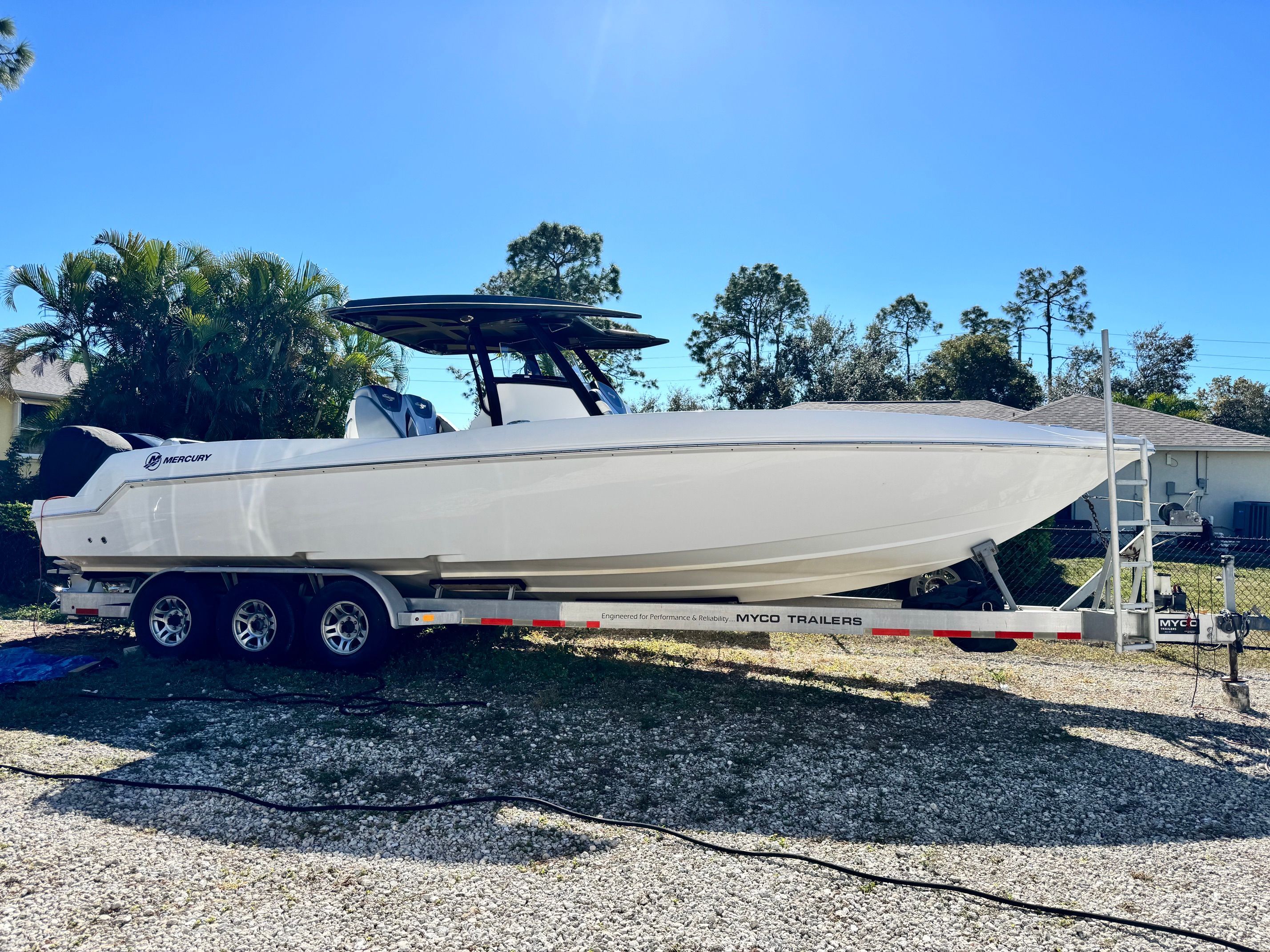 2017 Sunsation 32 CCX boat on trailer parked outdoors.